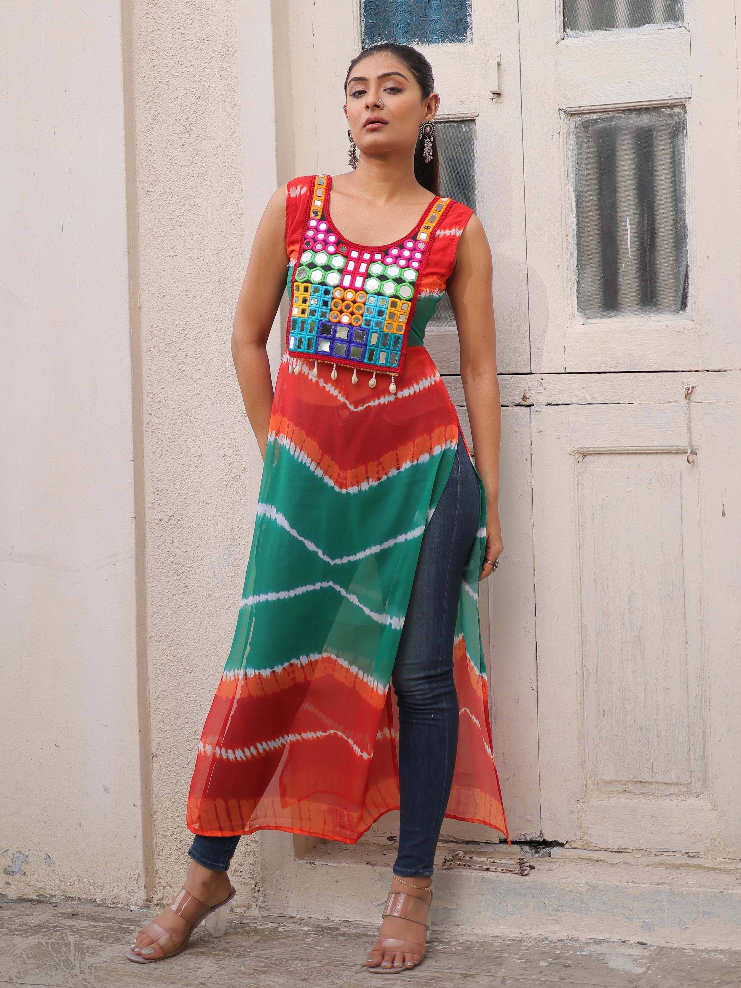 Colorful mirror work ethnic kurta with tie-dye print, paired with jeans for a fusion look