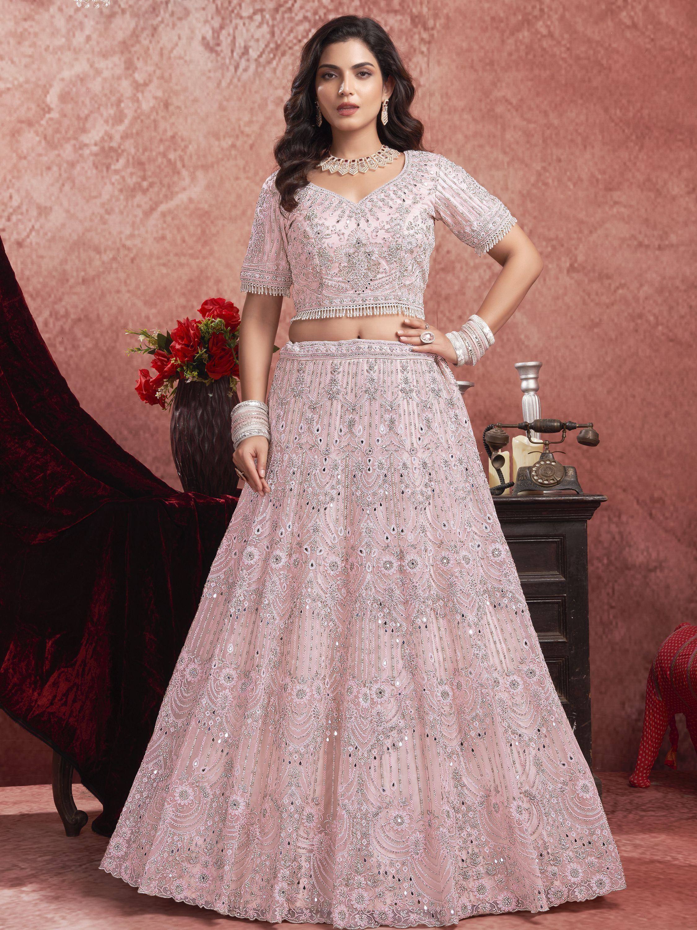 Elegant pink embroidered lehenga choli with intricate beadwork and sequins, perfect for Indian ethnic occasions.