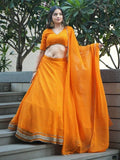 Amazing Orange Laheriya Print Georgette Haldi Wear Lehenga Choli
