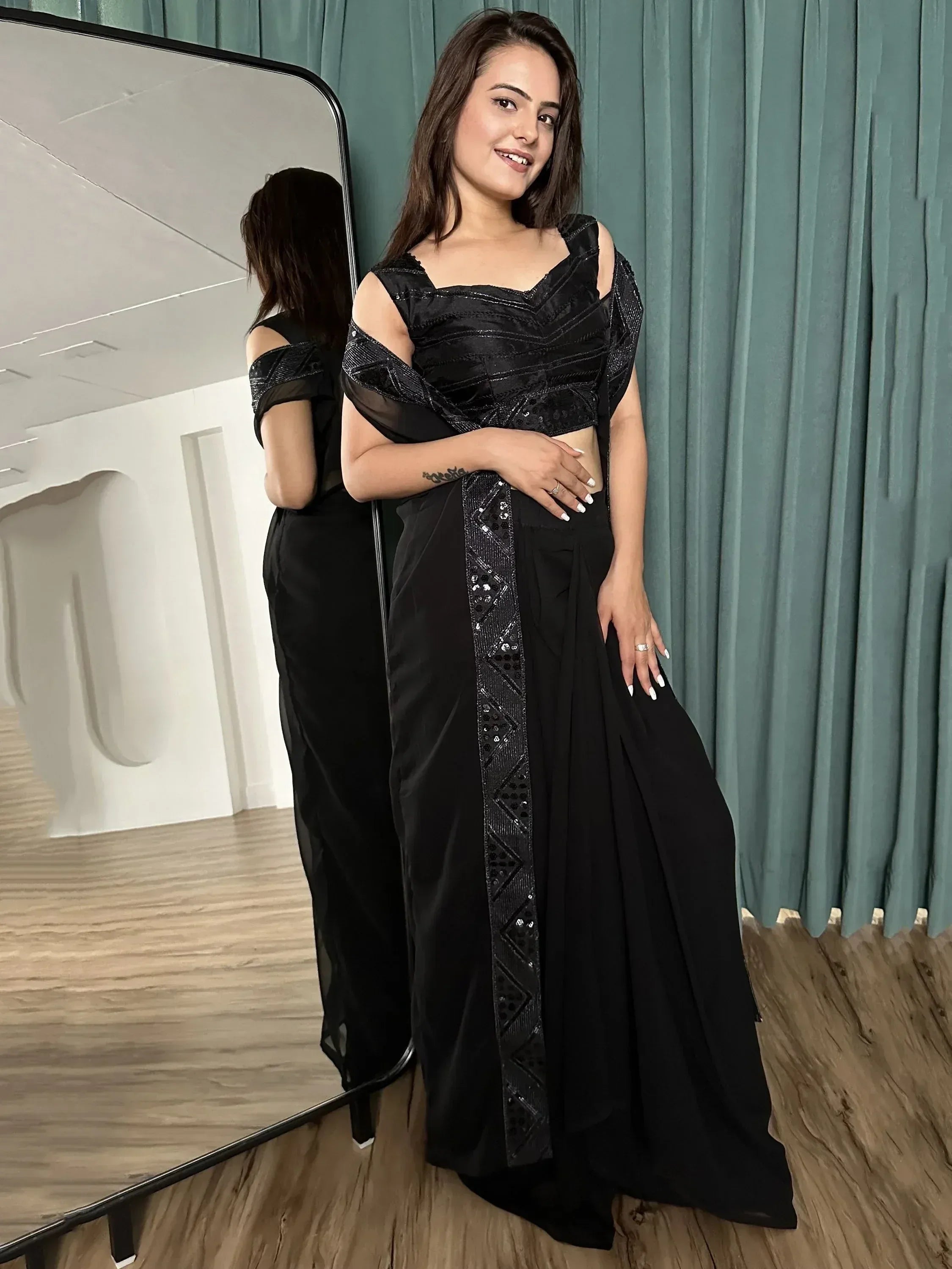 Black sequin ethnic gown with cold shoulder top and drape skirt, perfect for Indian festive wear