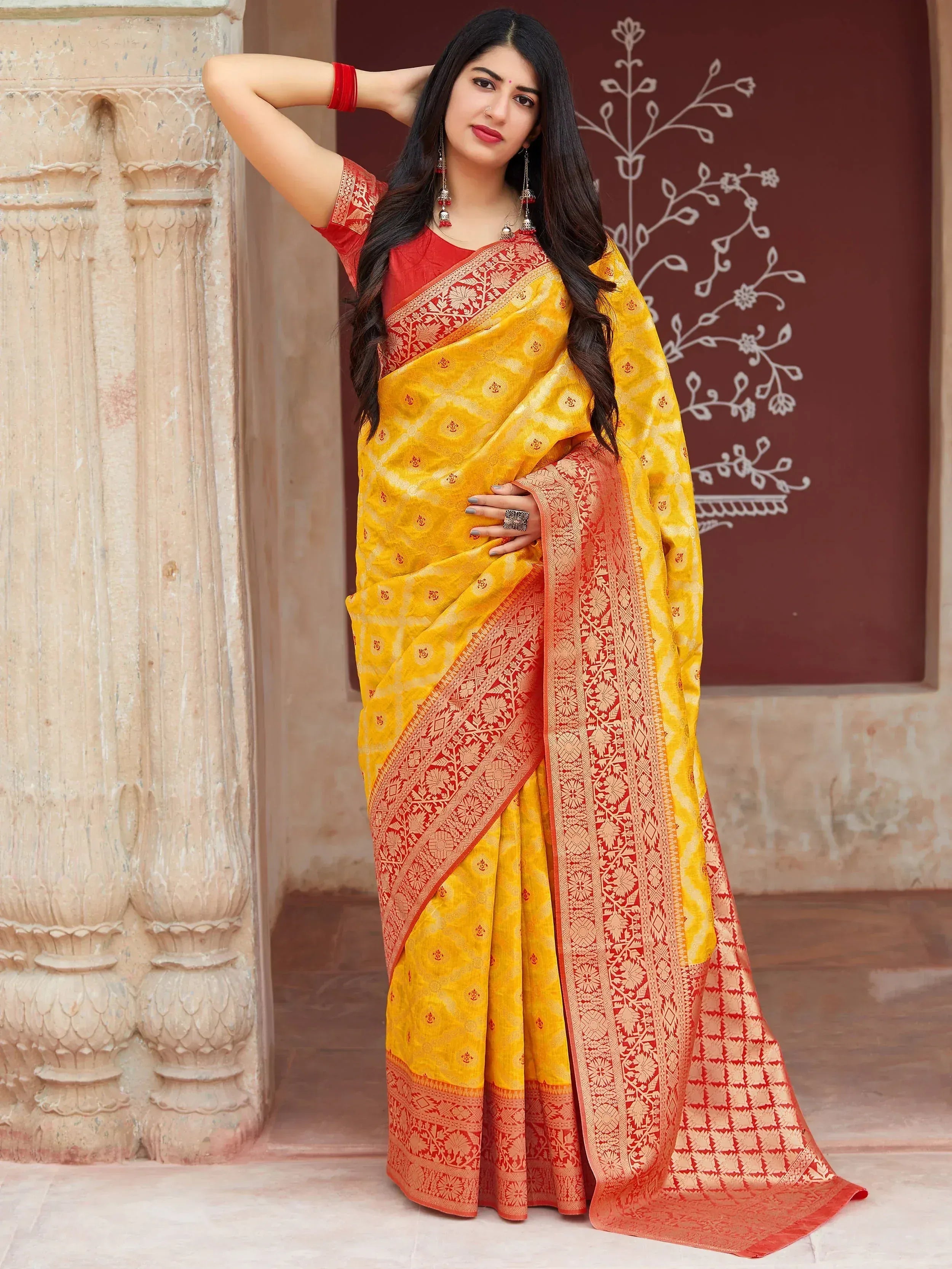 Yellow and red designer saree with intricate embroidery, perfect for Indian ethnic wear occasions.