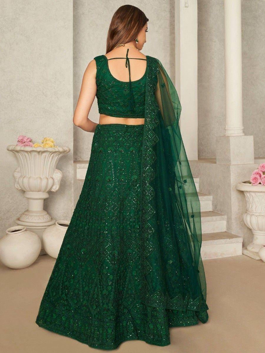 Emerald green designer lehenga choli with intricate embroidery and sheer dupatta, perfect for Indian ethnic wear occasions.