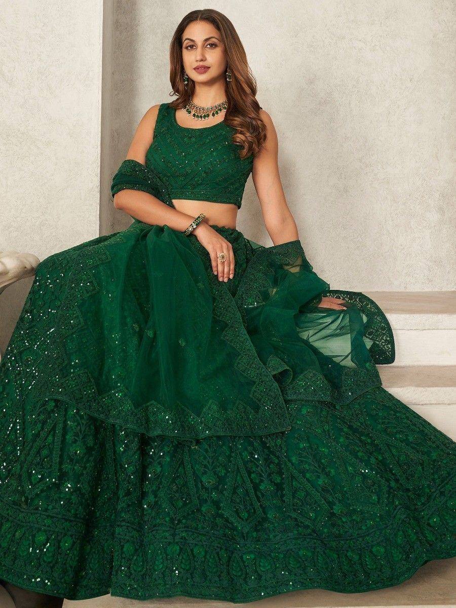 Emerald green designer lehenga choli with intricate embroidery and sequins, perfect for Indian ethnic wear