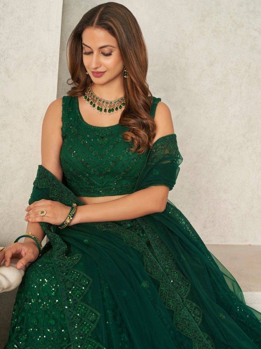 Emerald green designer lehenga choli with sequin embroidery and off-shoulder blouse for Indian ethnic wear
