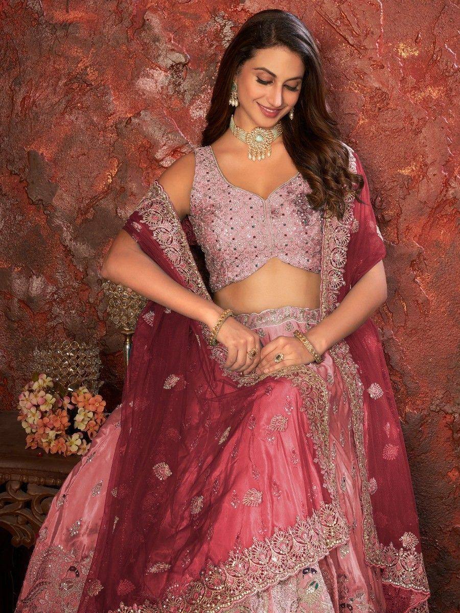 Pink embroidered lehenga choli with gold detailing, perfect for Indian weddings and festive occasions