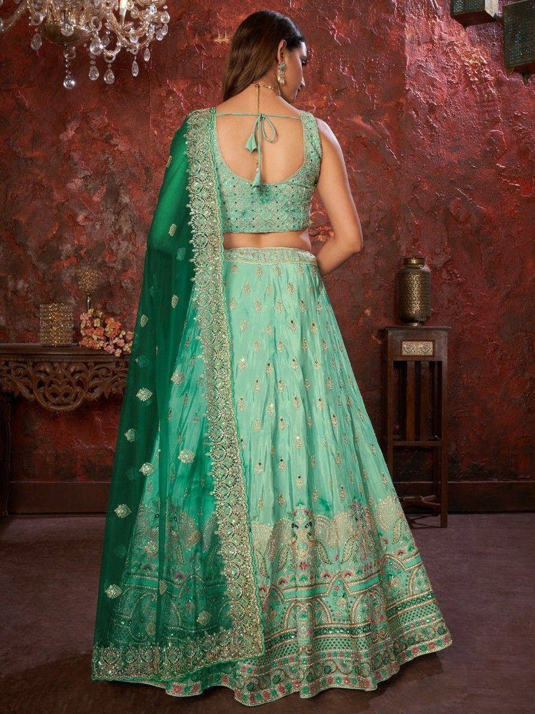 Mint green designer lehenga choli with gold embroidery and matching dupatta, elegant ethnic wear for weddings