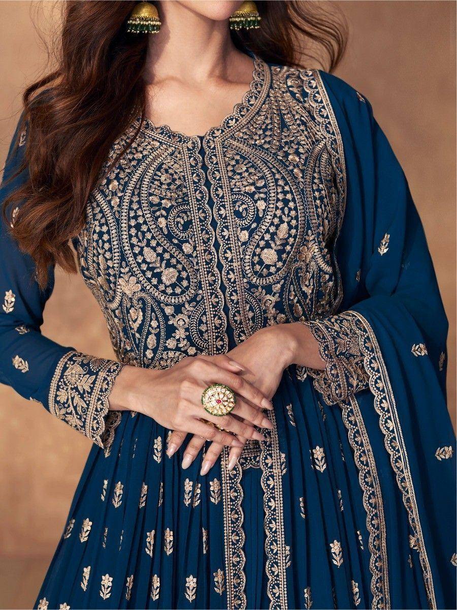 Elegant navy blue ethnic gown with gold embroidery, perfect for Indian occasions and festive wear.
