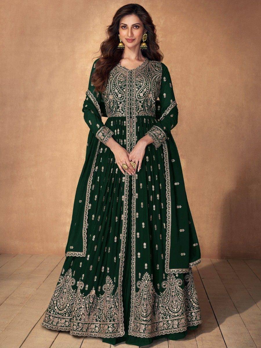 Woman wearing dark green embroidered ethnic gown with dupatta, traditional Indian fashion