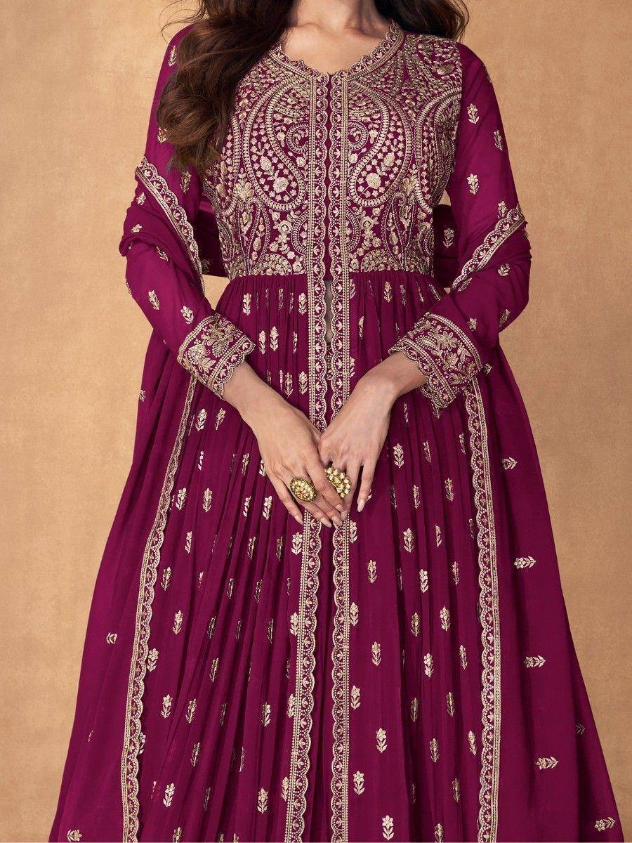 Elegant maroon ethnic gown with gold embroidery, perfect for Indian festive occasions and weddings.