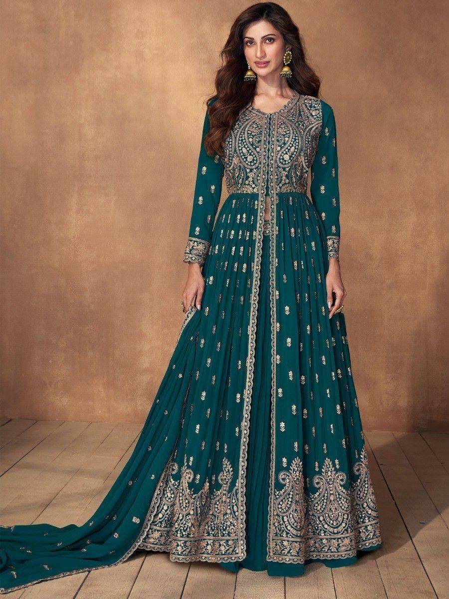 Emerald green designer anarkali gown with gold embroidery, perfect for Indian ethnic wear occasions.