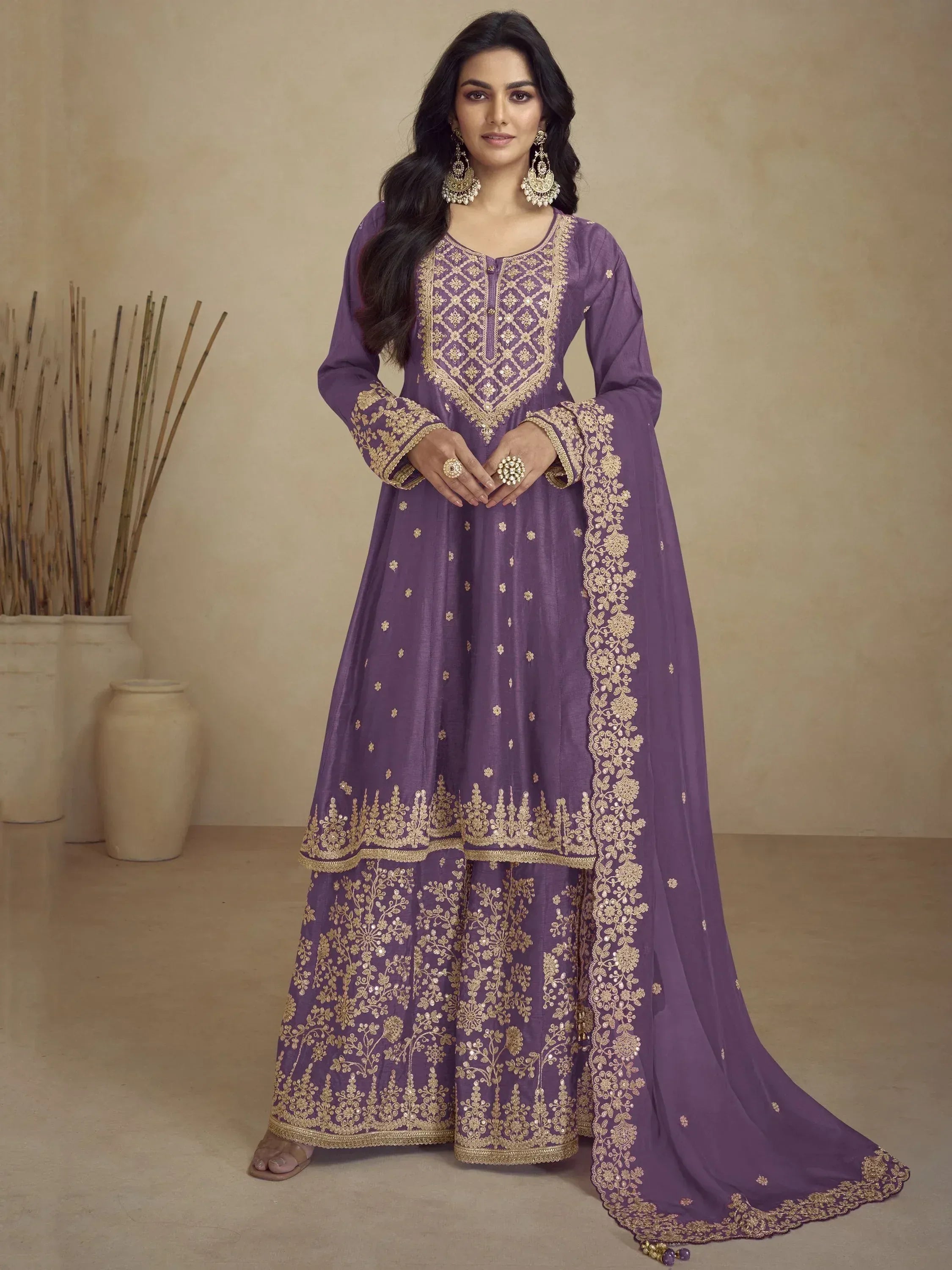 Purple Indian ethnic anarkali suit with gold embroidery, perfect for weddings and festive occasions.