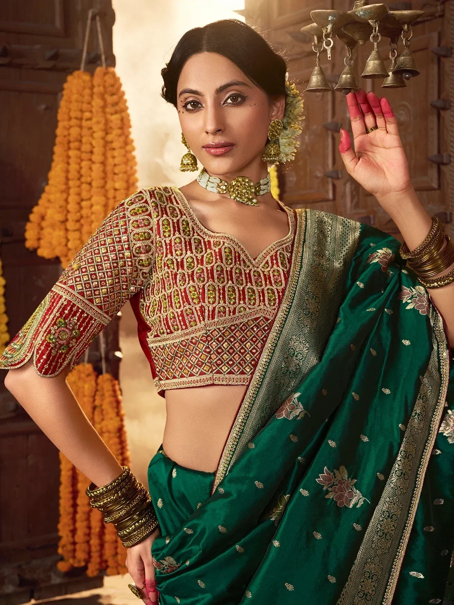 Elegant green saree with red embroidered blouse, traditional Indian ethnic wear, perfect for festive occasions.