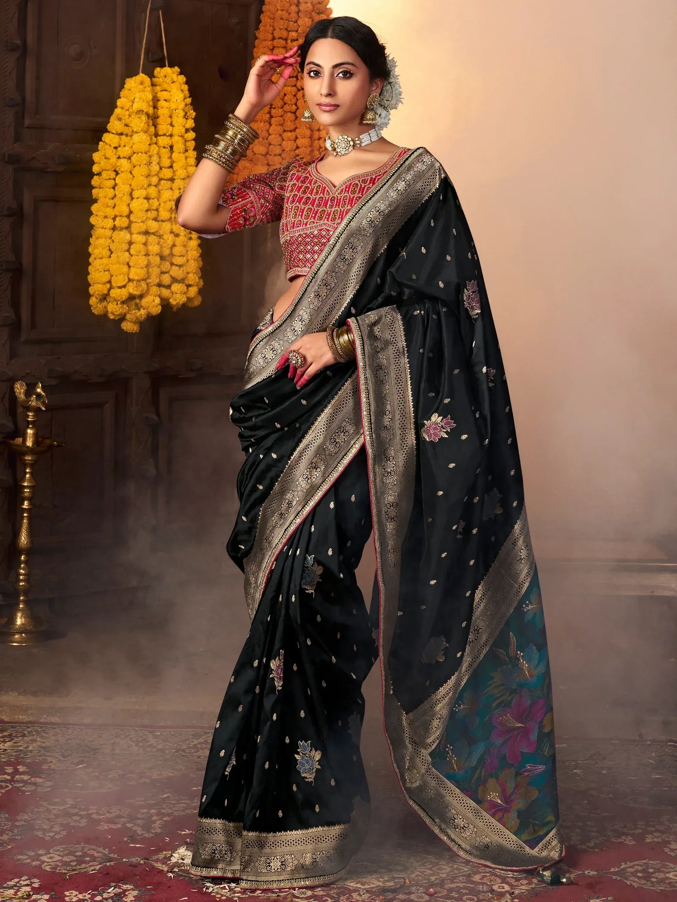 Black floral saree with gold border and red blouse, traditional Indian ethnic wear for women