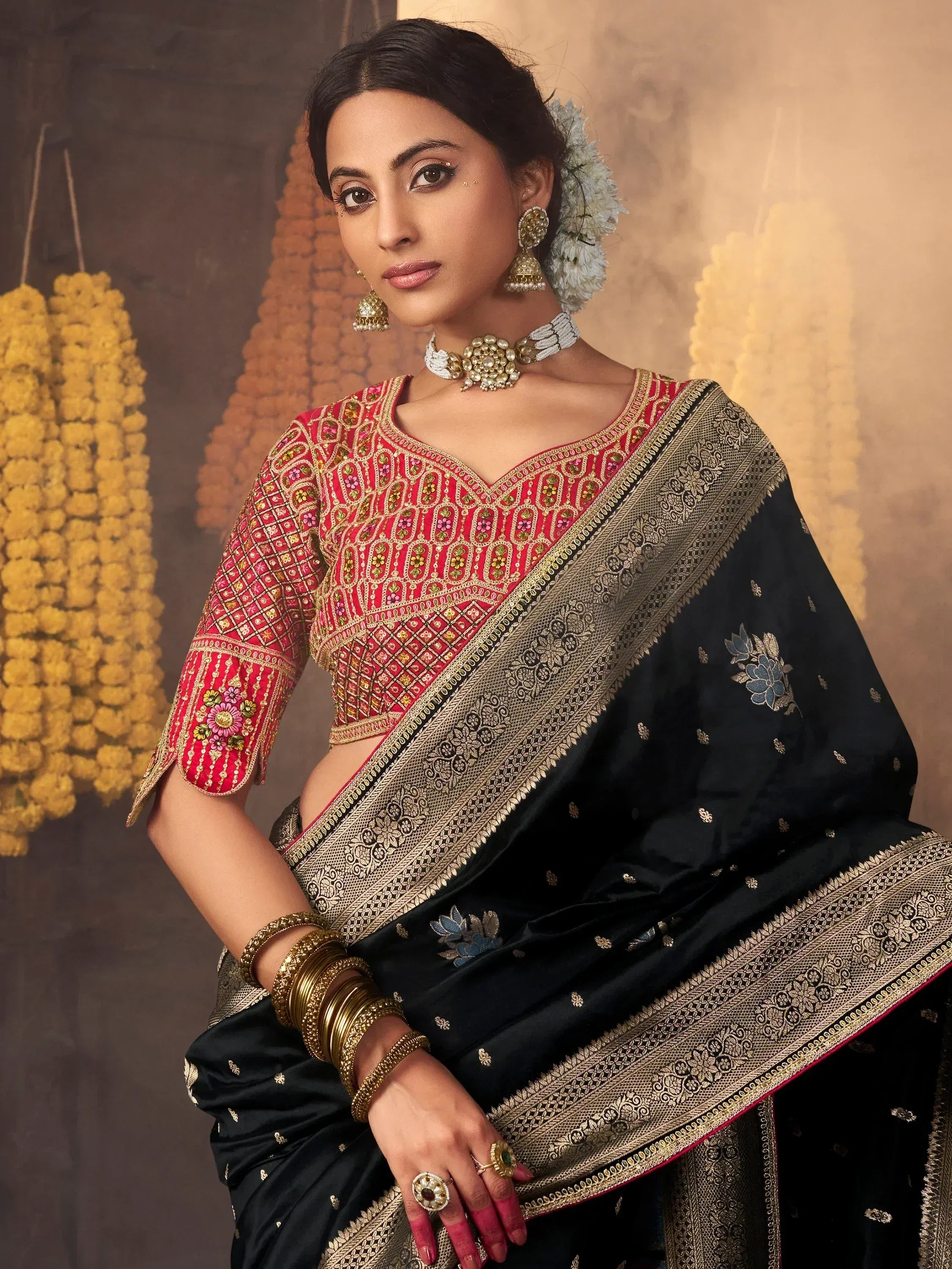 Black saree with gold border and red embroidered blouse, traditional Indian ethnic wear