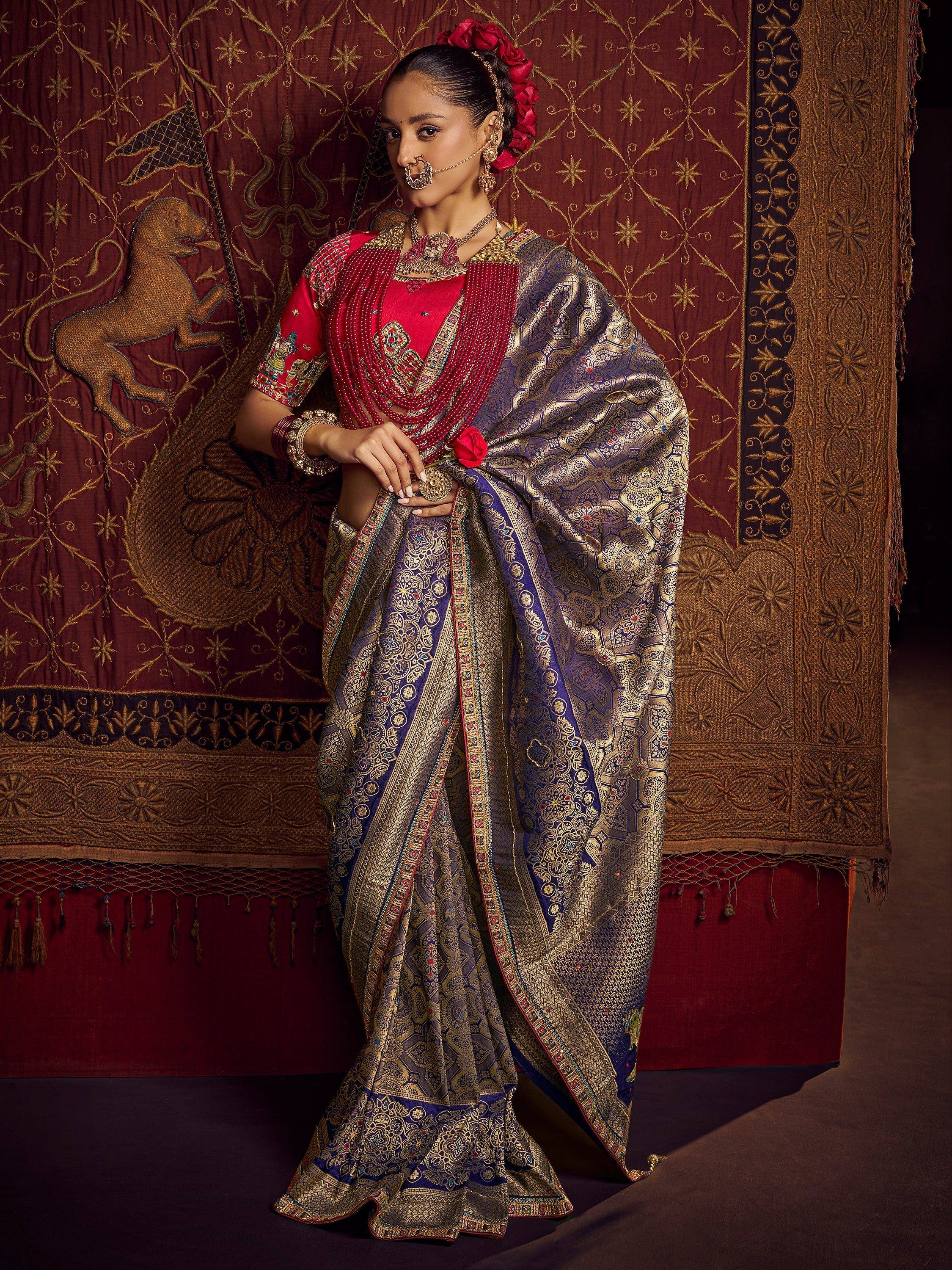 Elegant woman in royal blue and gold Banarasi saree with red blouse, traditional Indian ethnic wear
