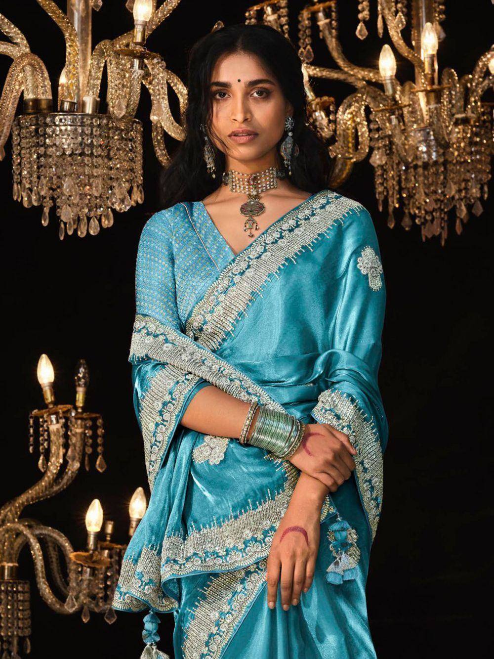 Turquoise designer saree with silver embroidery, perfect for Indian ethnic wear occasions