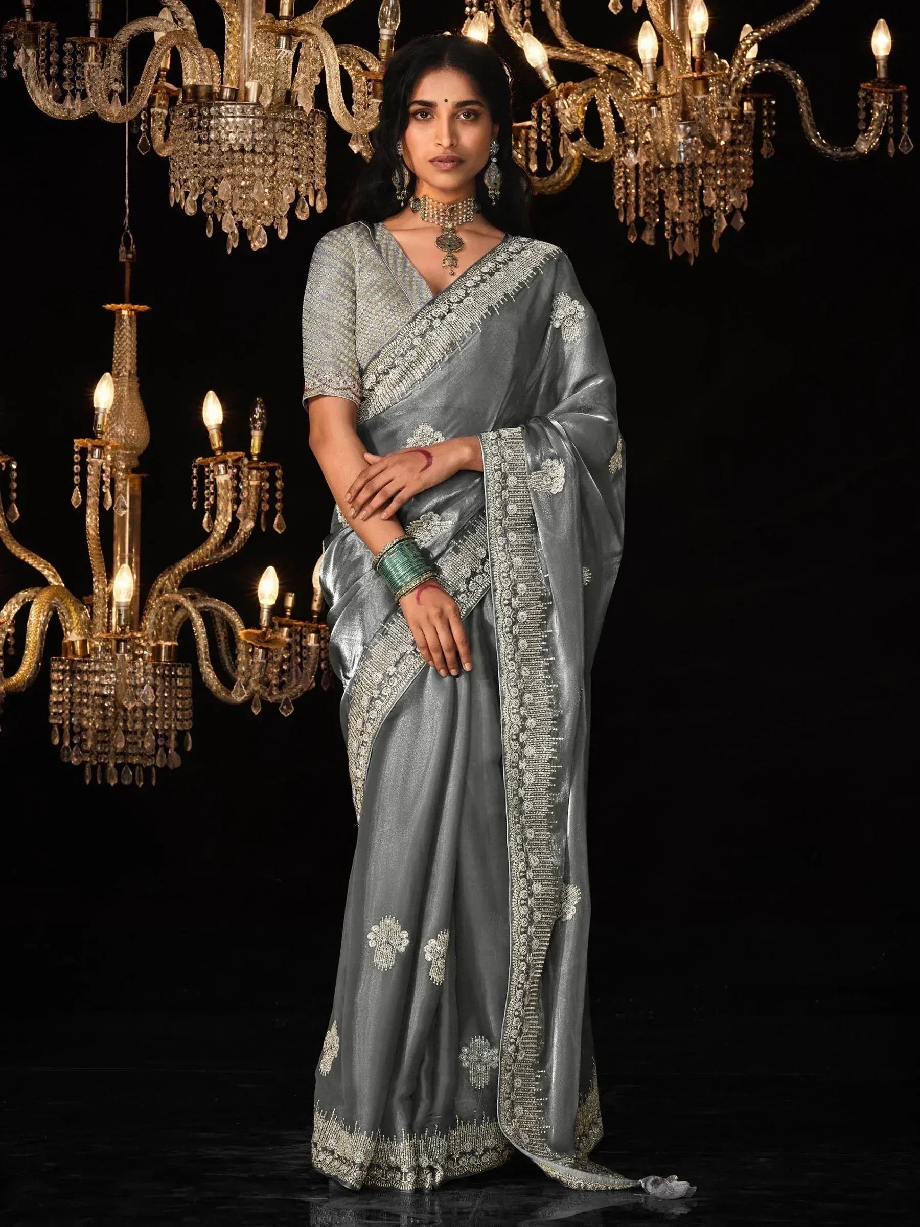 Elegant grey saree with intricate silver embroidery, perfect for Indian ethnic wear occasions.