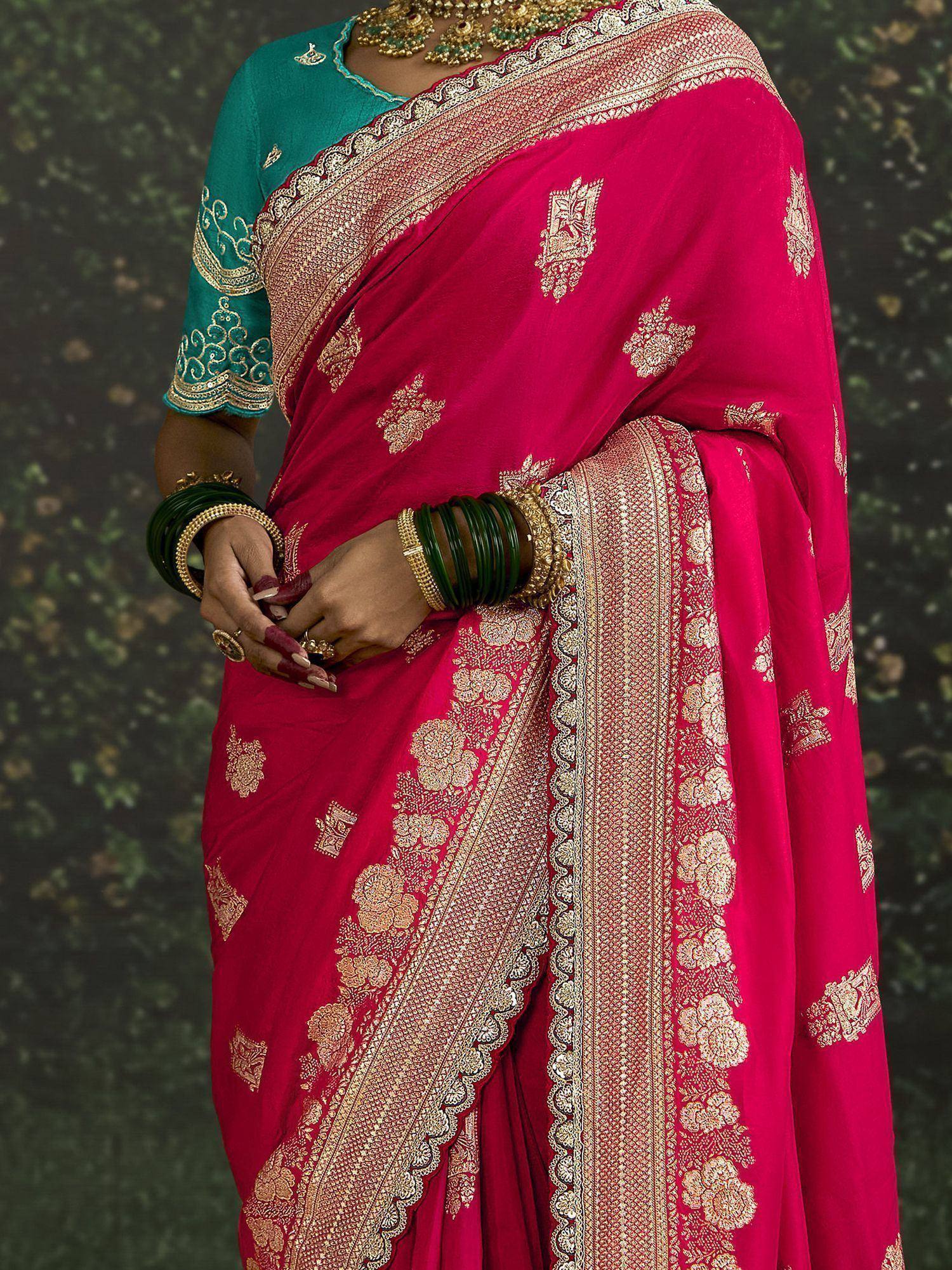Red embroidered saree with gold border and teal blouse, traditional Indian ethnic wear