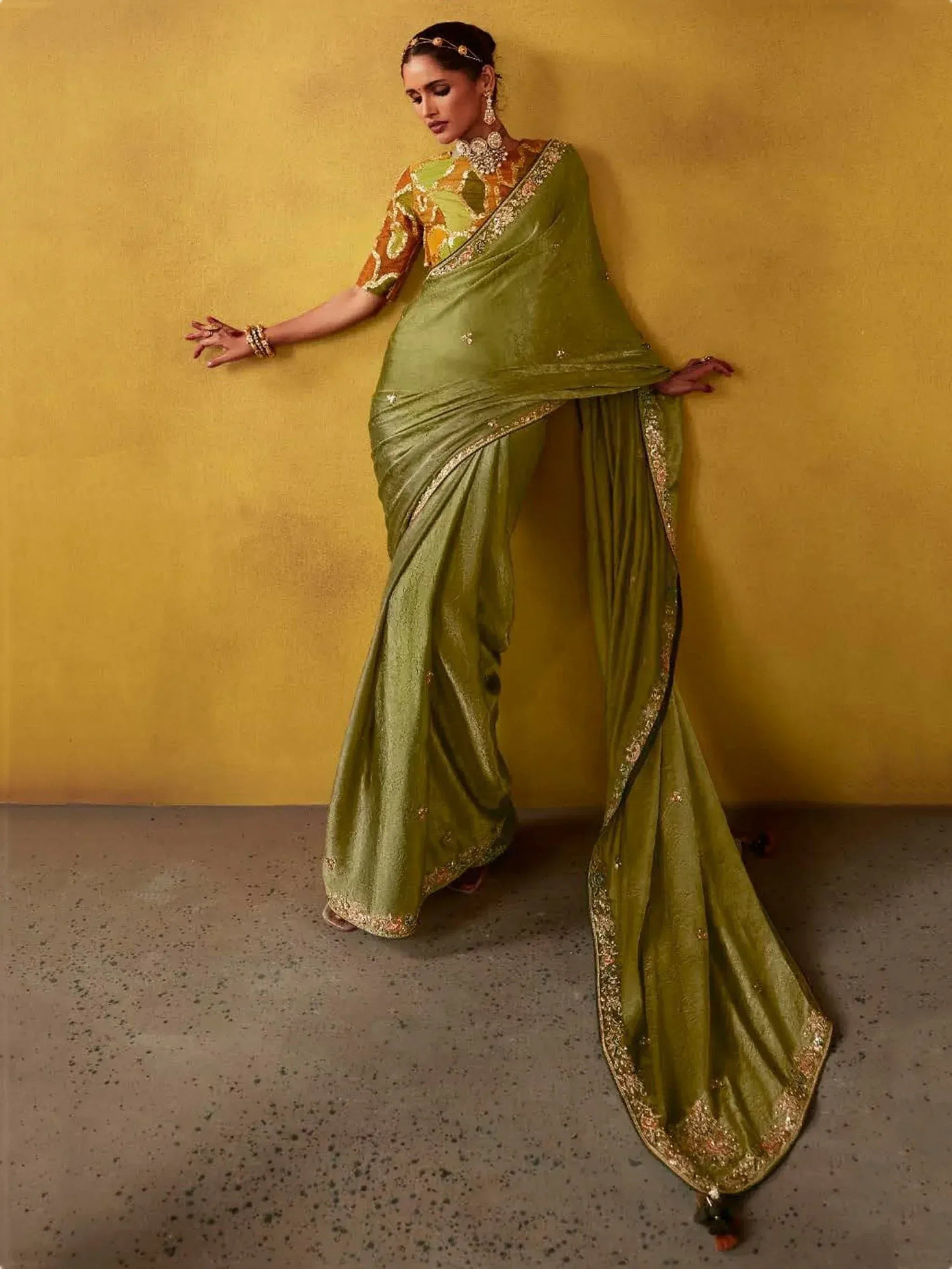 Elegant olive green saree with gold embroidery, paired with printed blouse, perfect for Indian ethnic occasions.