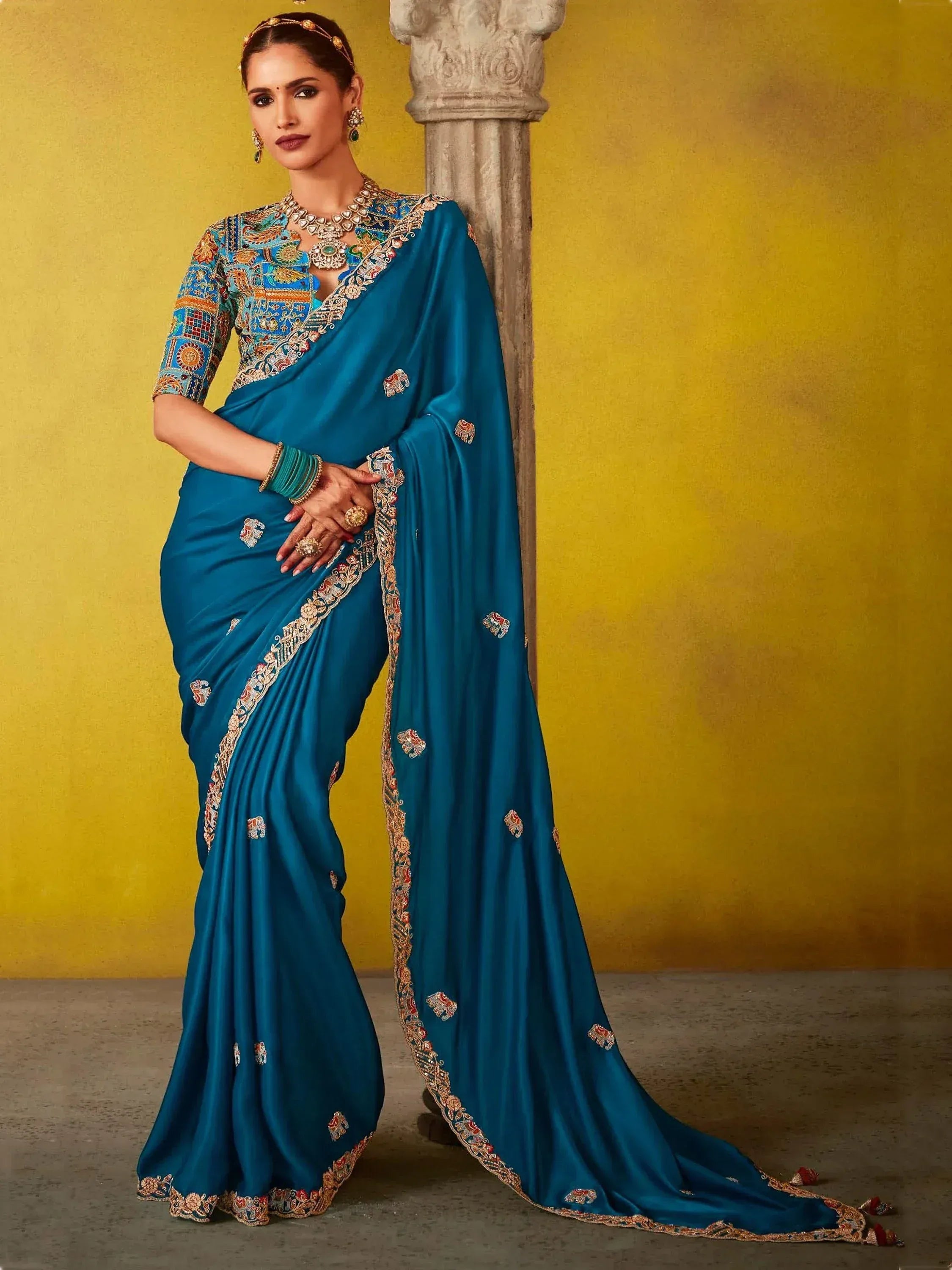 Teal blue embroidered saree with elephant motifs and heavy blouse, perfect for Indian ethnic occasions