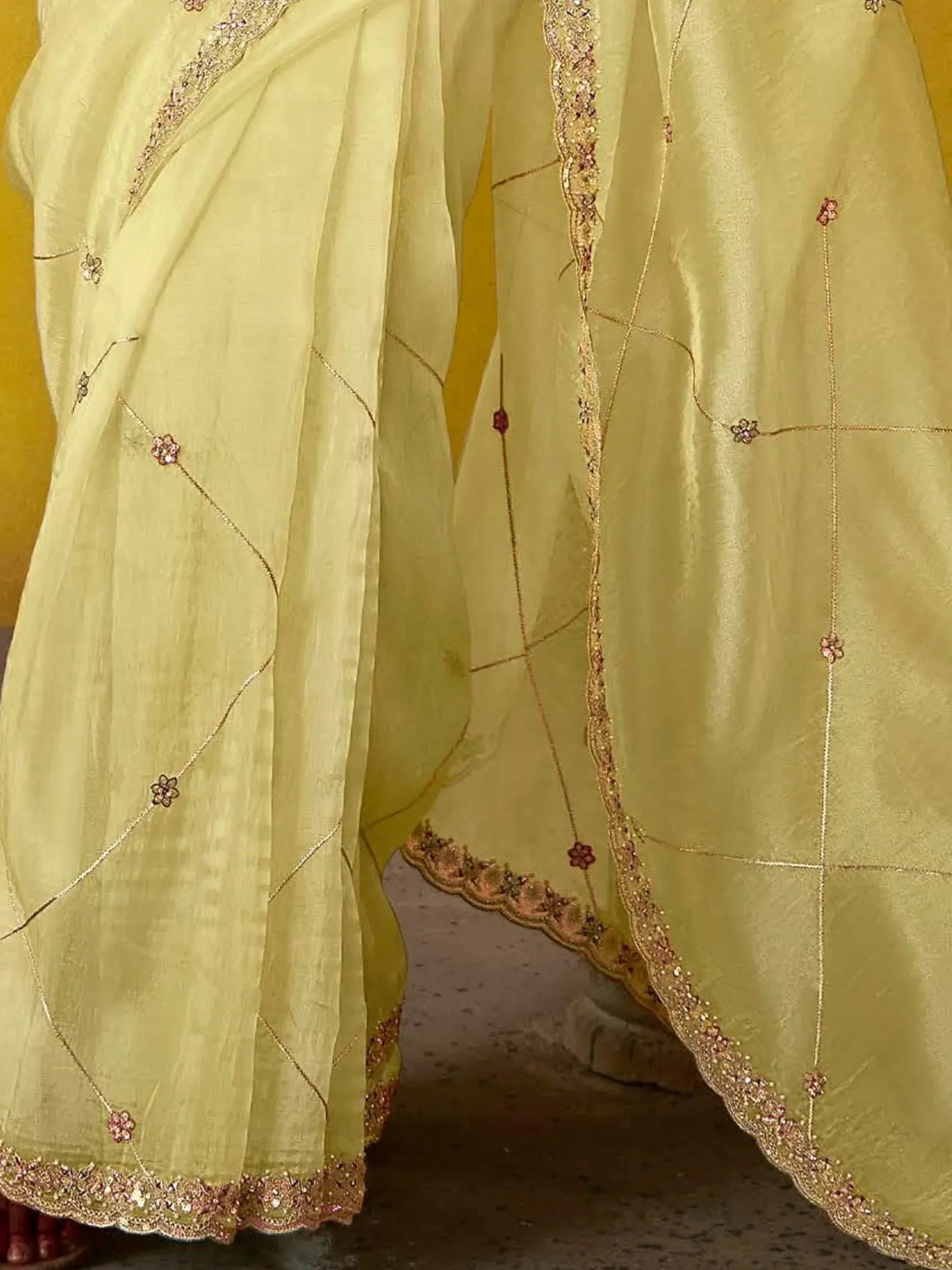 Light green ethnic gown with gold embroidery and floral beadwork, perfect for Indian occasions