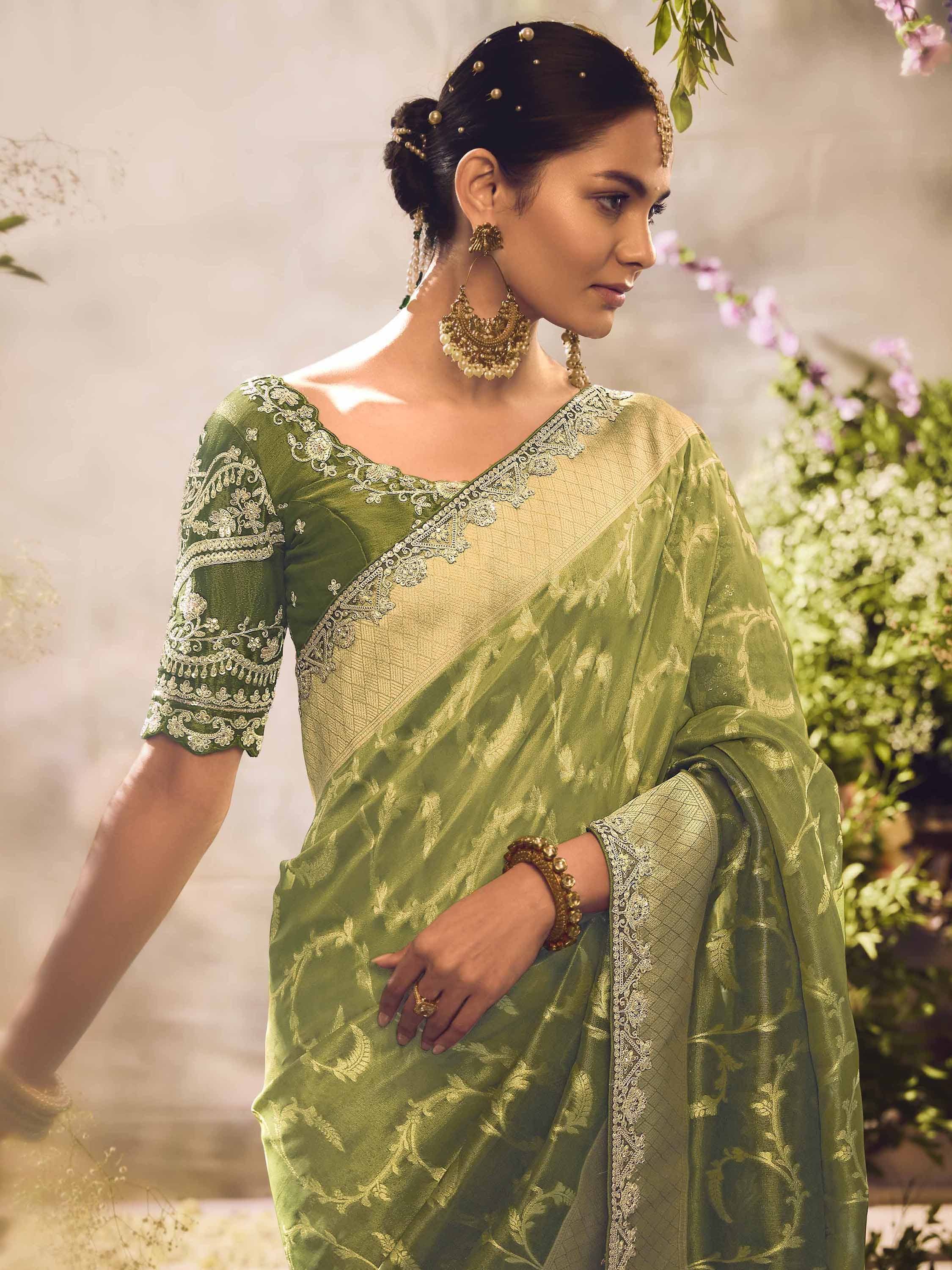 Elegant green embroidered saree with gold detailing, perfect for Indian ethnic occasions and weddings.