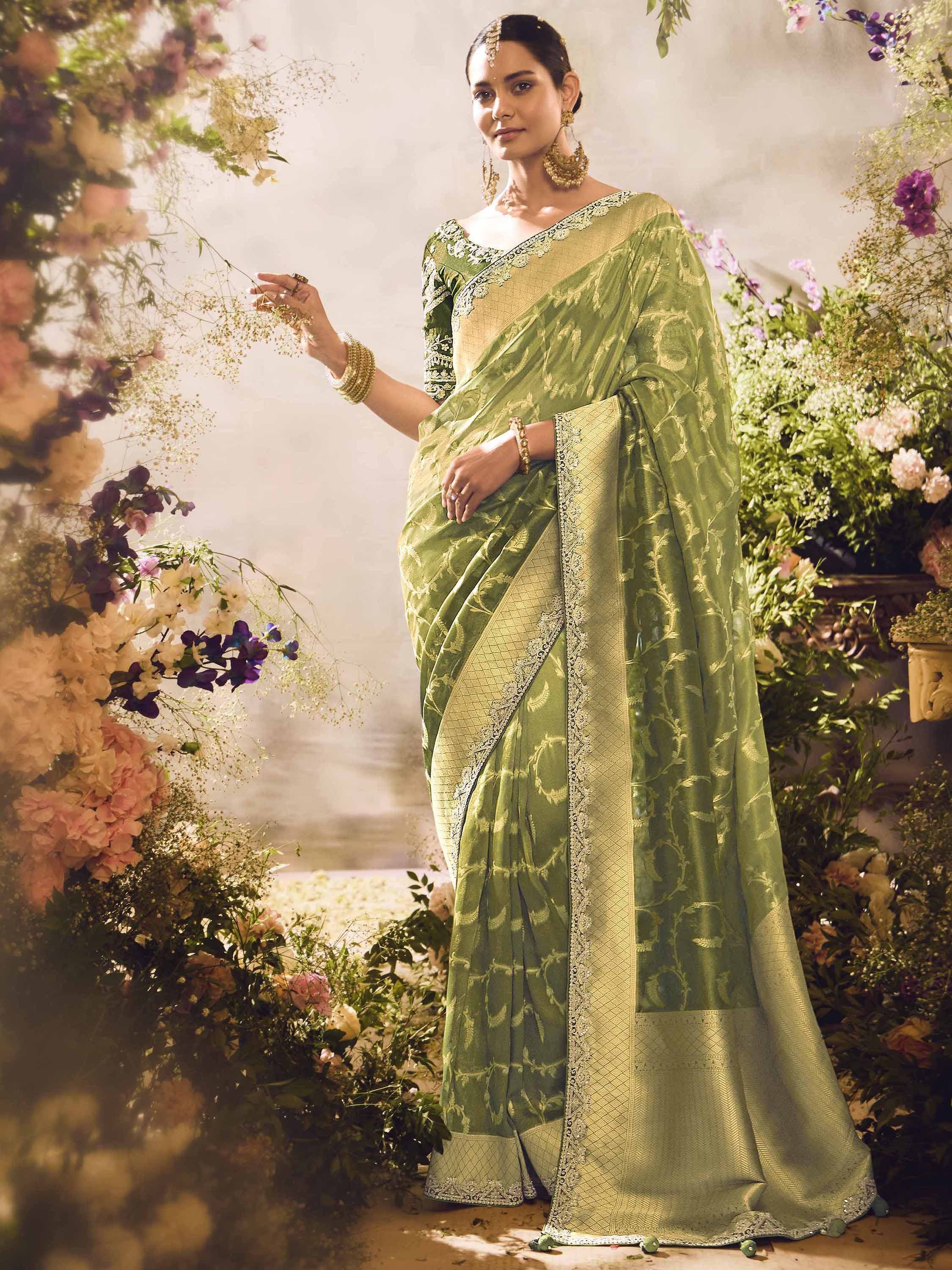 Elegant green designer saree with gold embroidery, perfect for Indian ethnic wear occasions