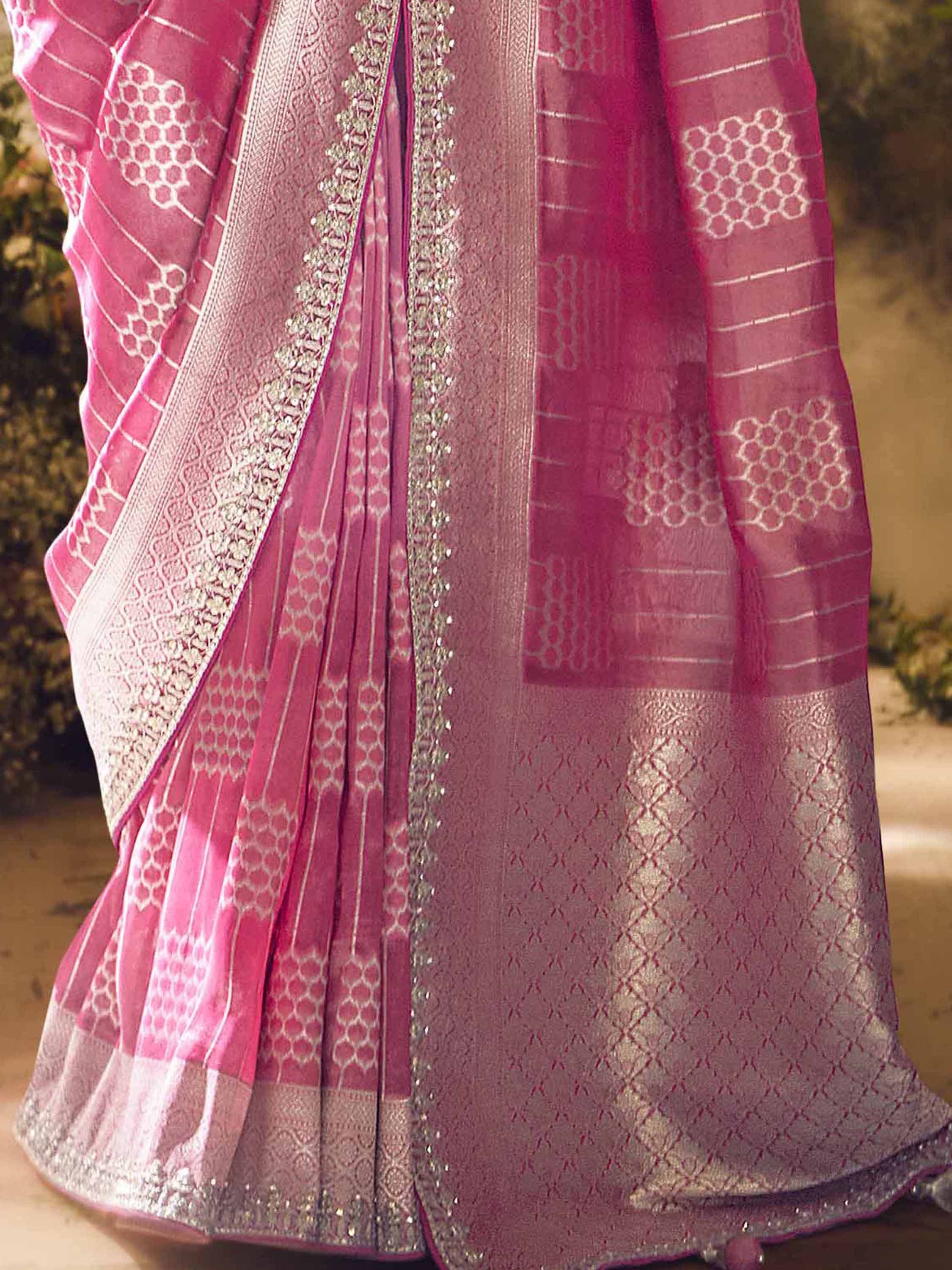 Pink designer saree with silver zari work and geometric patterns, perfect for ethnic occasions