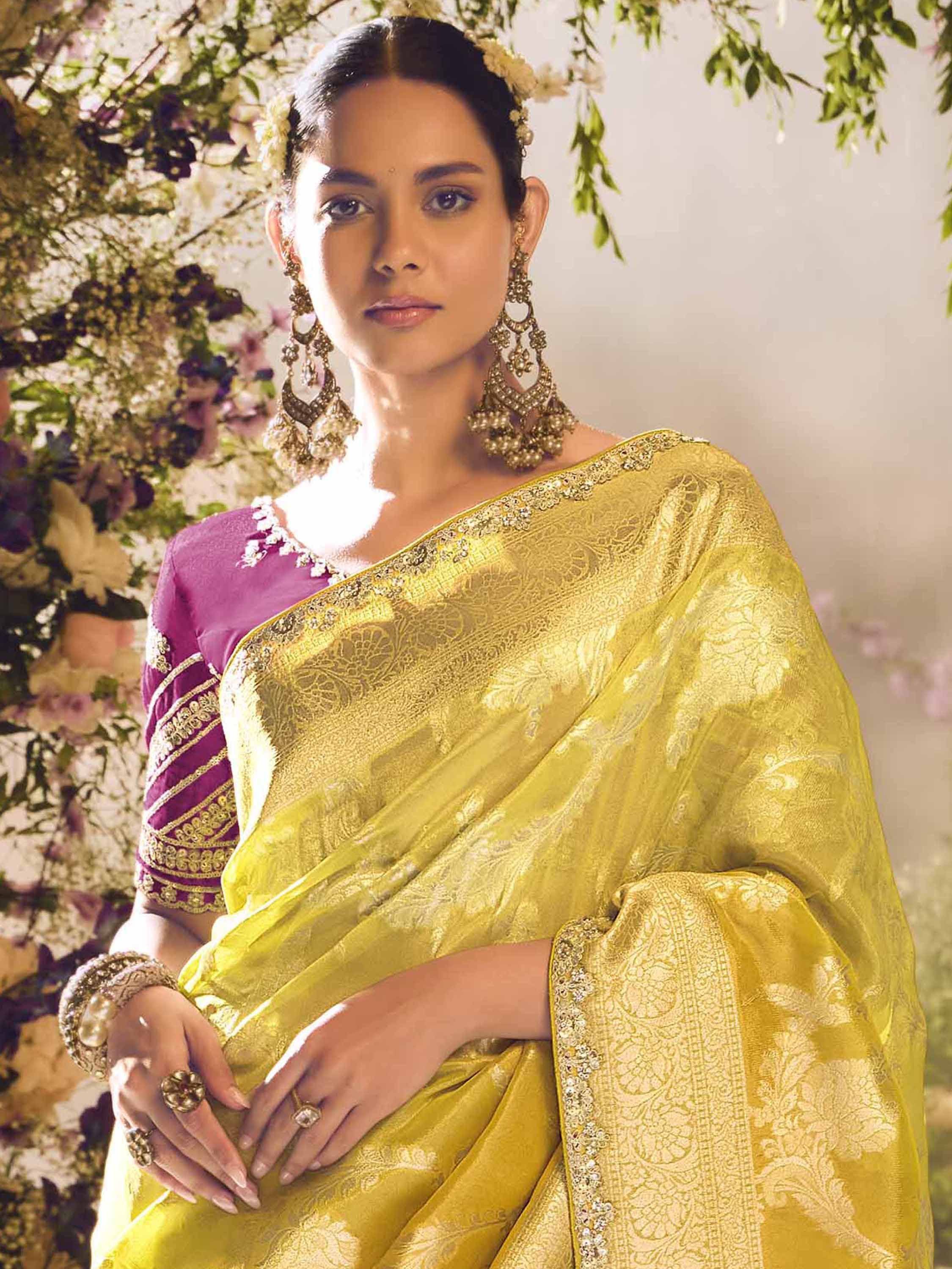 Elegant yellow designer saree with purple blouse, perfect for Indian ethnic wear and festive occasions.