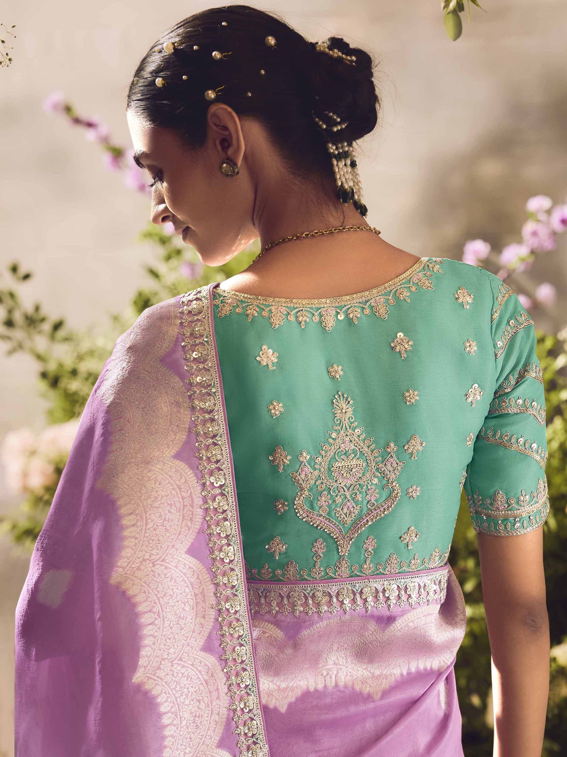 Elegant green and purple ethnic saree with gold embroidery, perfect for Indian weddings and festive occasions.