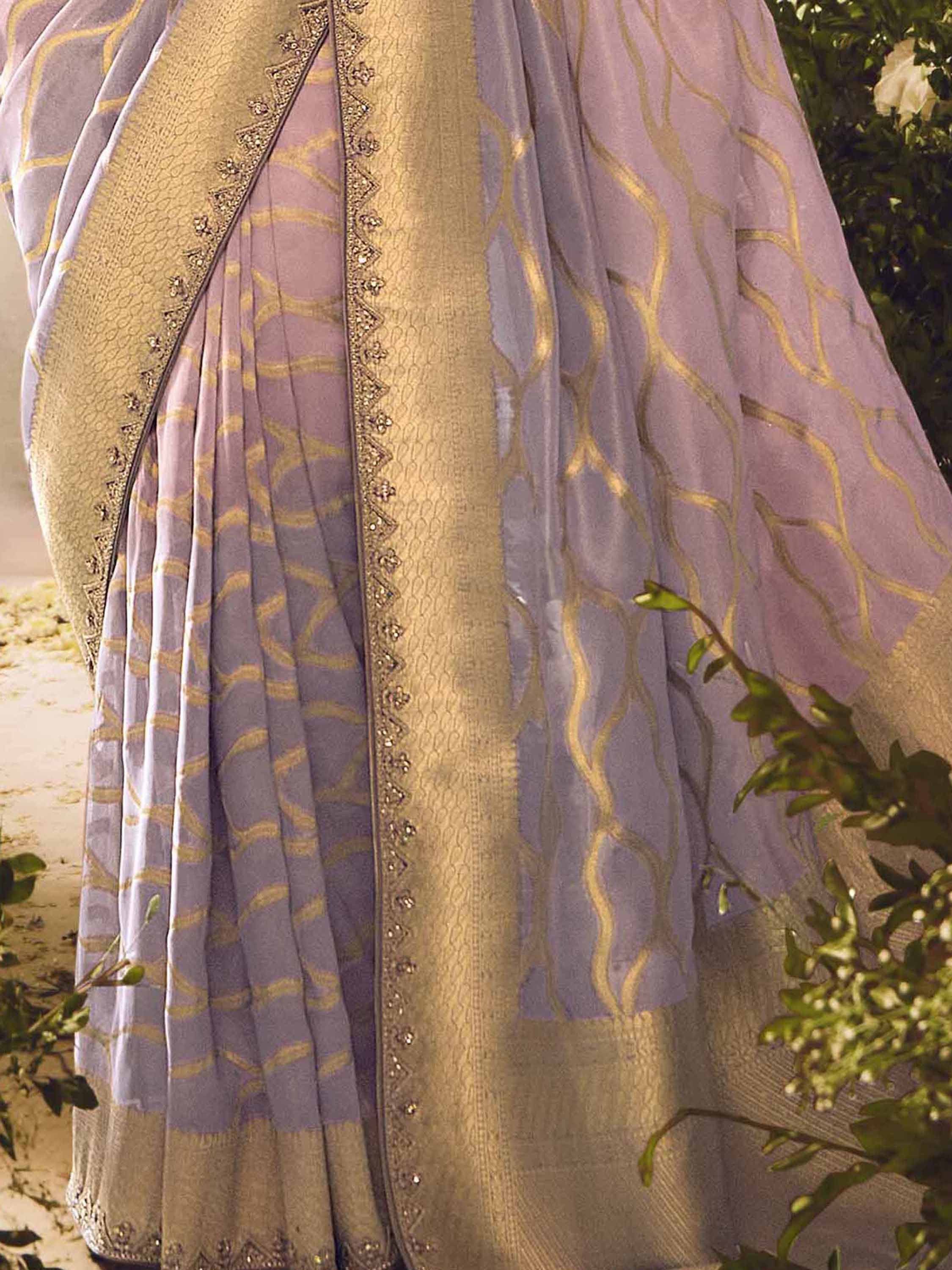 Lavender and gold designer lehenga with intricate embroidery and pleated skirt, perfect for Indian ethnic wear.