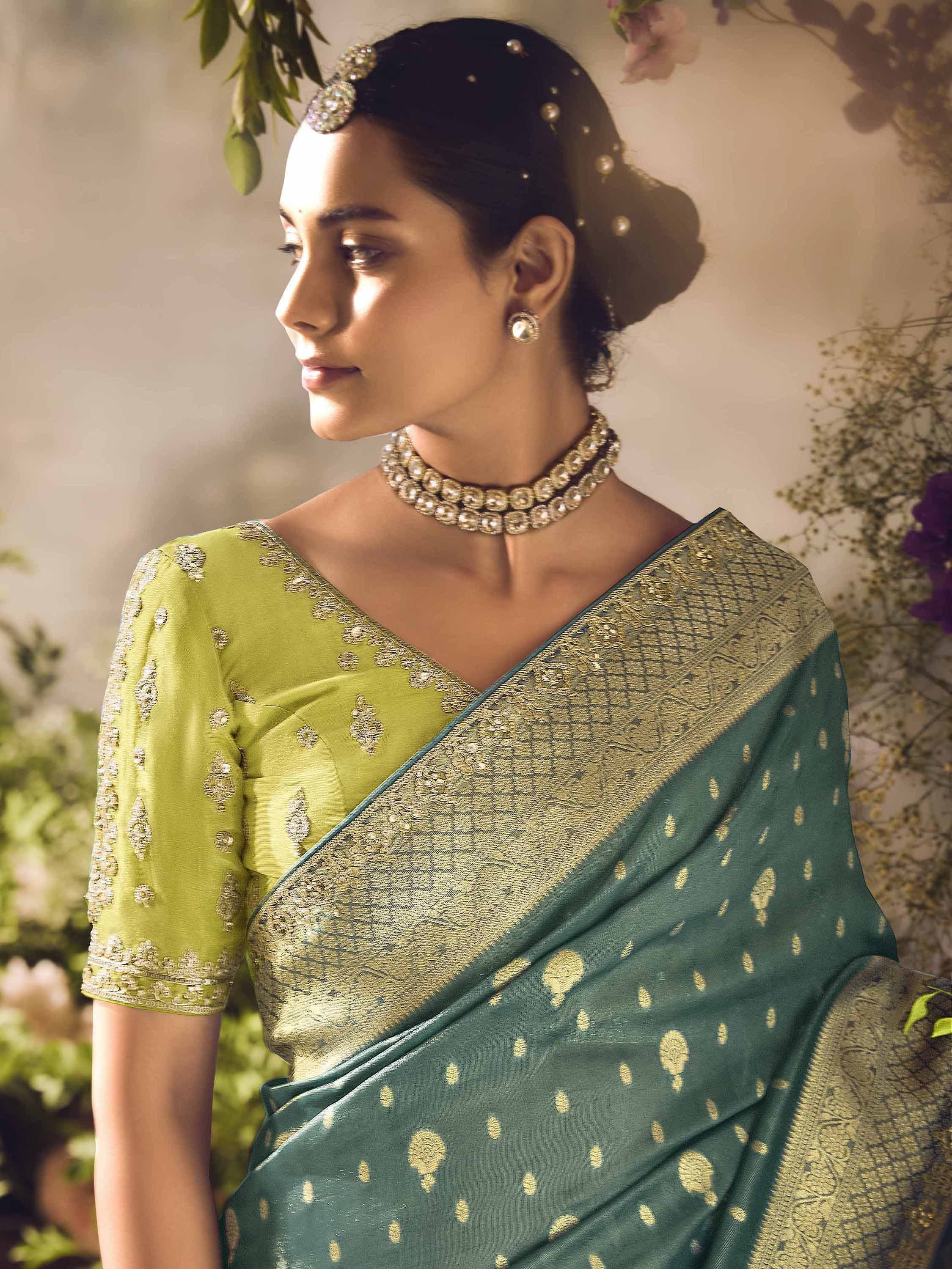 Elegant green saree with gold embroidery and matching blouse, perfect for Indian ethnic occasions.