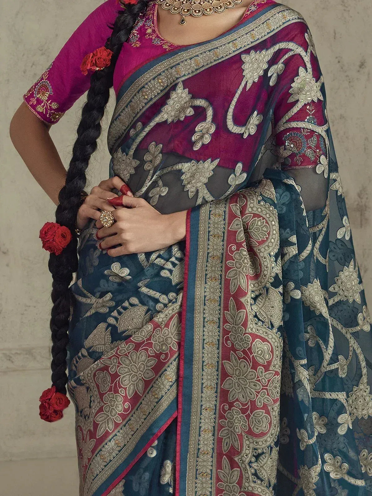 Elegant Indian saree with floral embroidery, pink blouse, and red rose accents for ethnic wear
