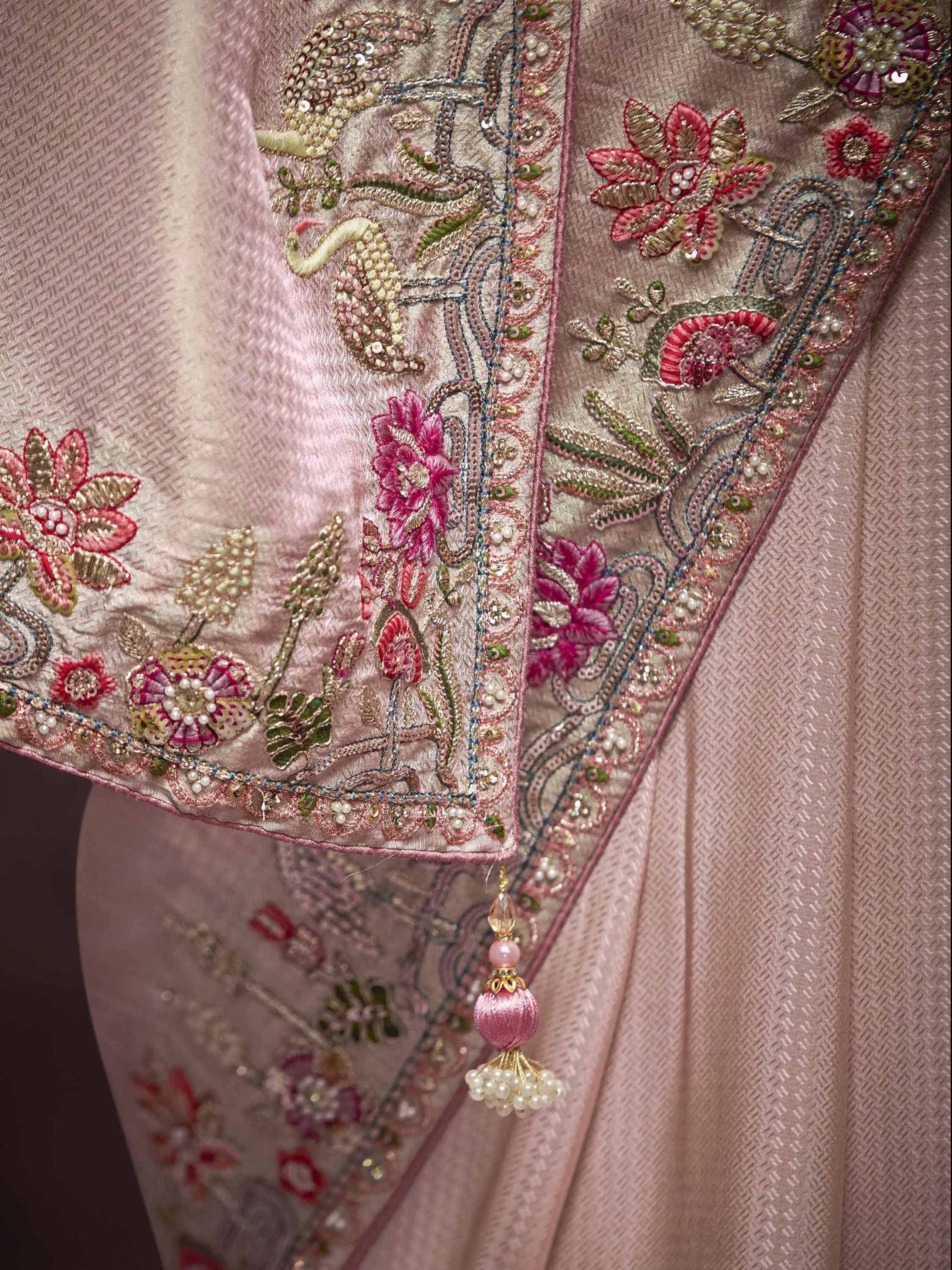 Pink ethnic wear with floral embroidery, sequins, and pearl tassels for designer lehenga or saree