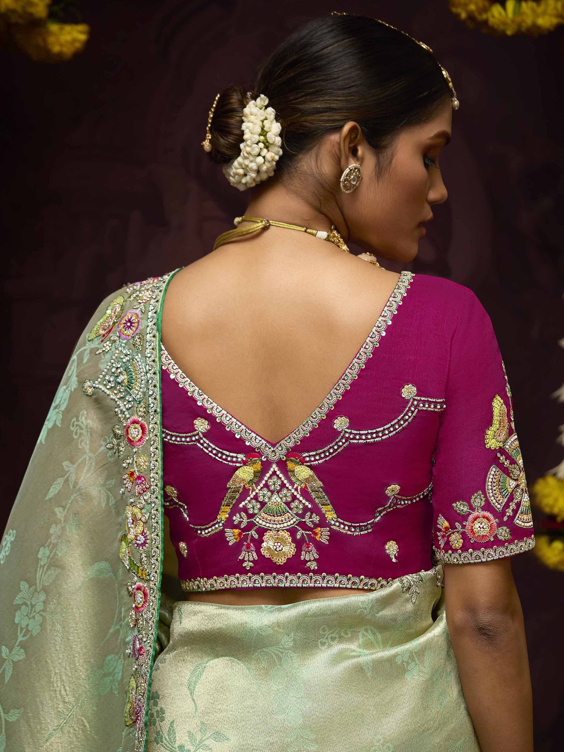 Elegant Indian ethnic wear with embroidered magenta blouse and green saree, perfect for weddings and festivals