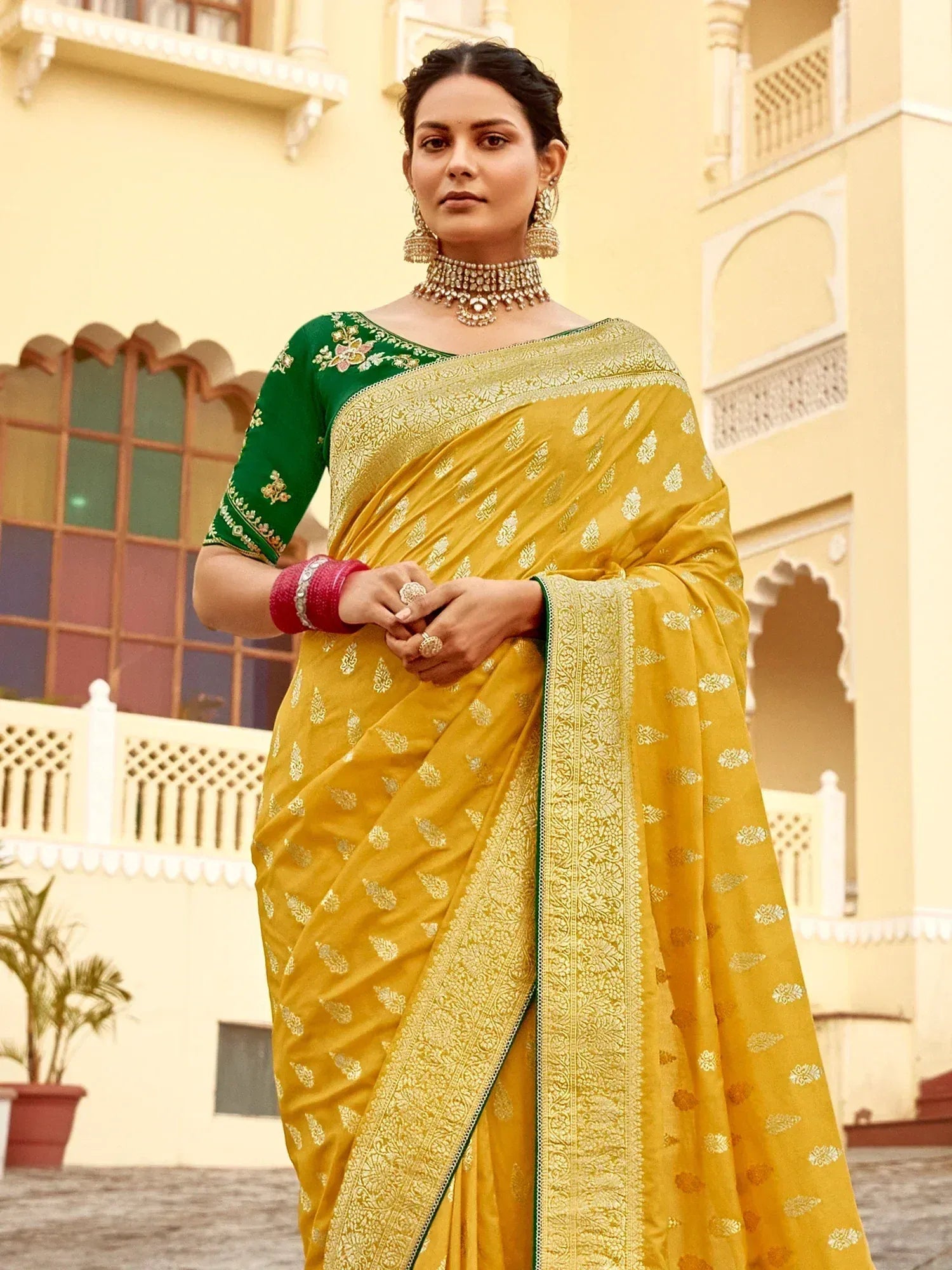 Yellow saree with gold embroidery and green blouse, traditional Indian ethnic wear