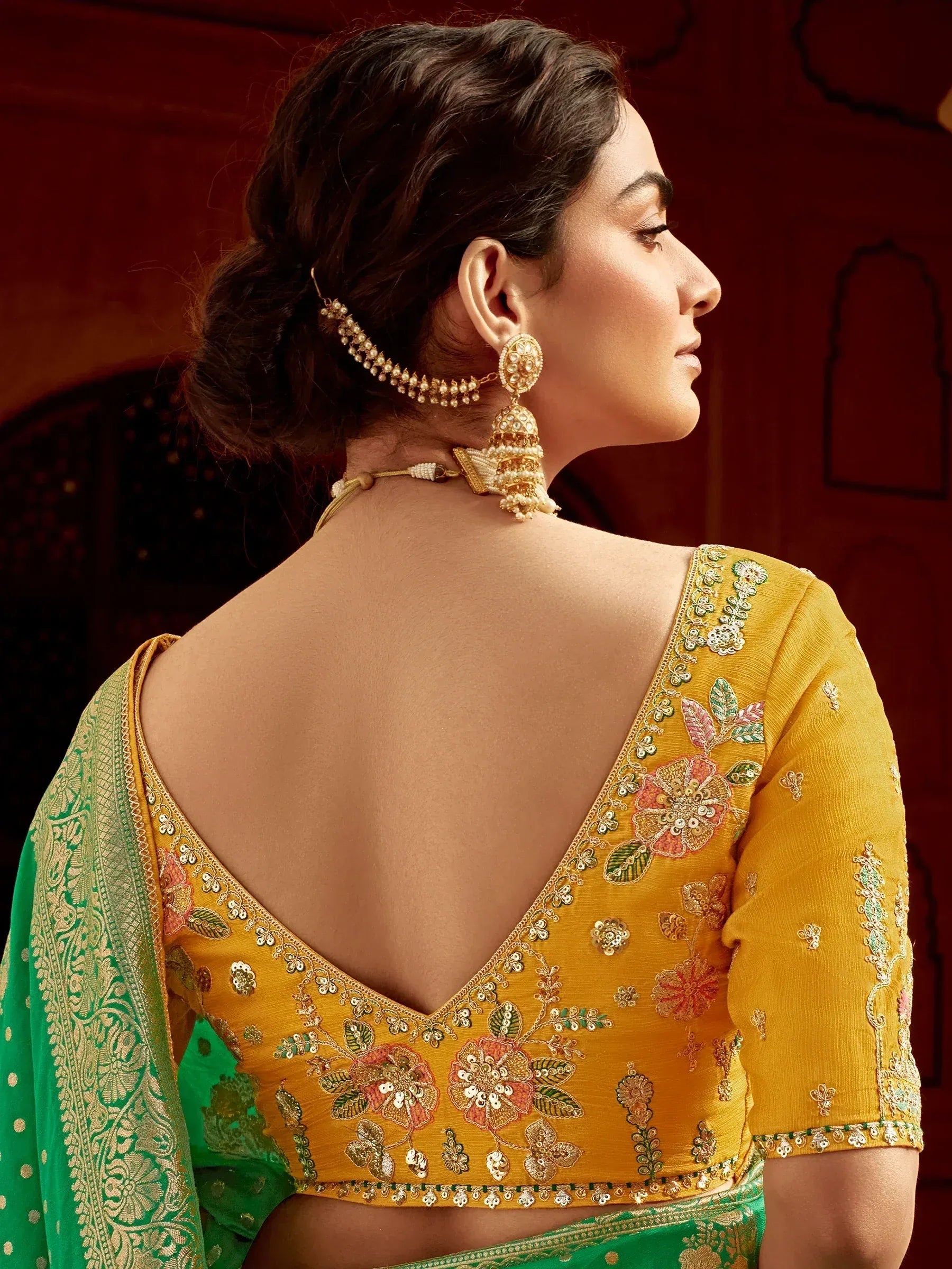 Yellow floral embroidered blouse with green saree, back view, traditional Indian ethnic wear