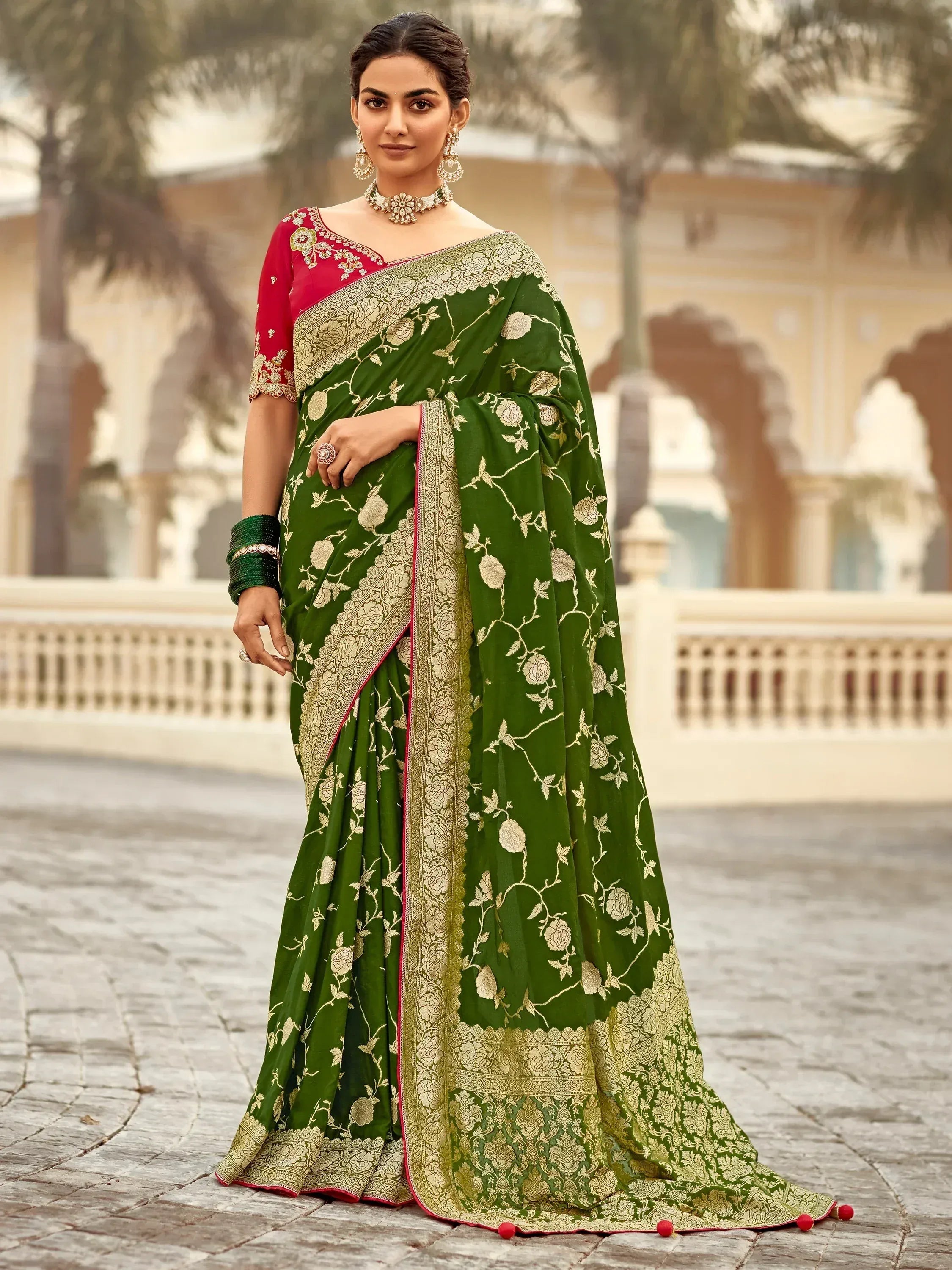 Green floral embroidered saree with gold border and red blouse, perfect for Indian ethnic wear