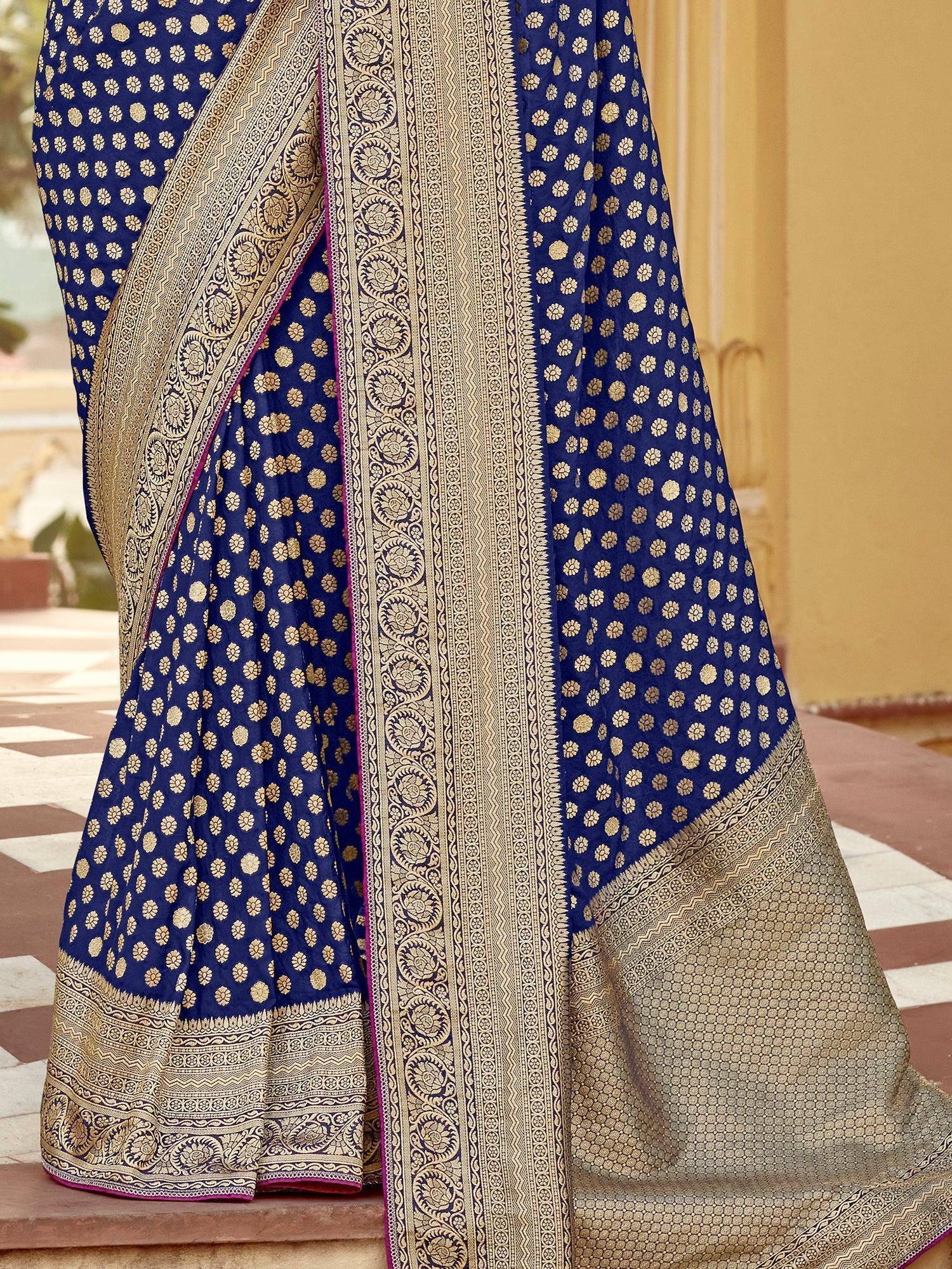 Blue saree with gold floral motifs and intricate border design