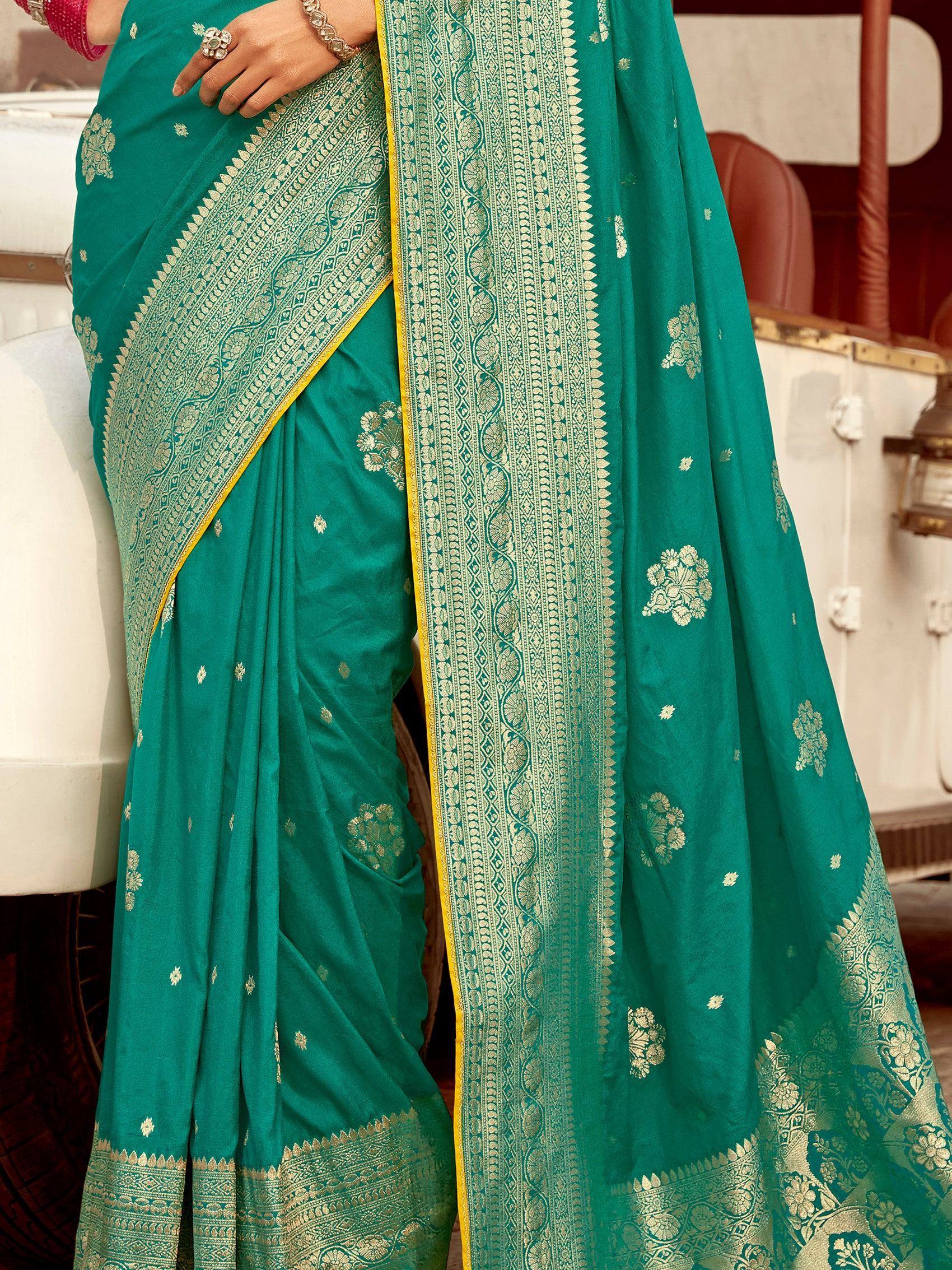 Teal green saree with gold floral motifs and intricate border, perfect for ethnic occasions