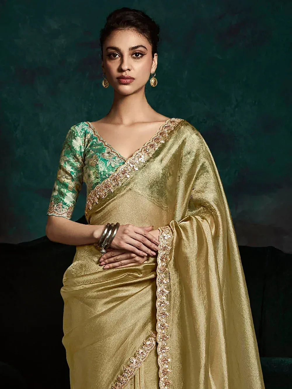 Golden saree with floral green blouse, perfect for Indian ethnic occasions and festive wear.