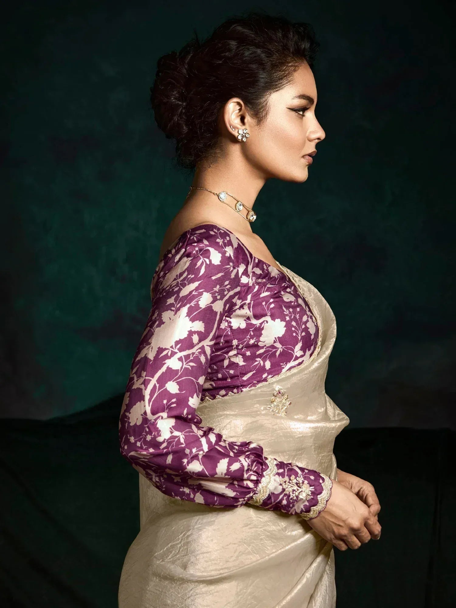 Woman in purple floral blouse with gold saree, ethnic Indian wear