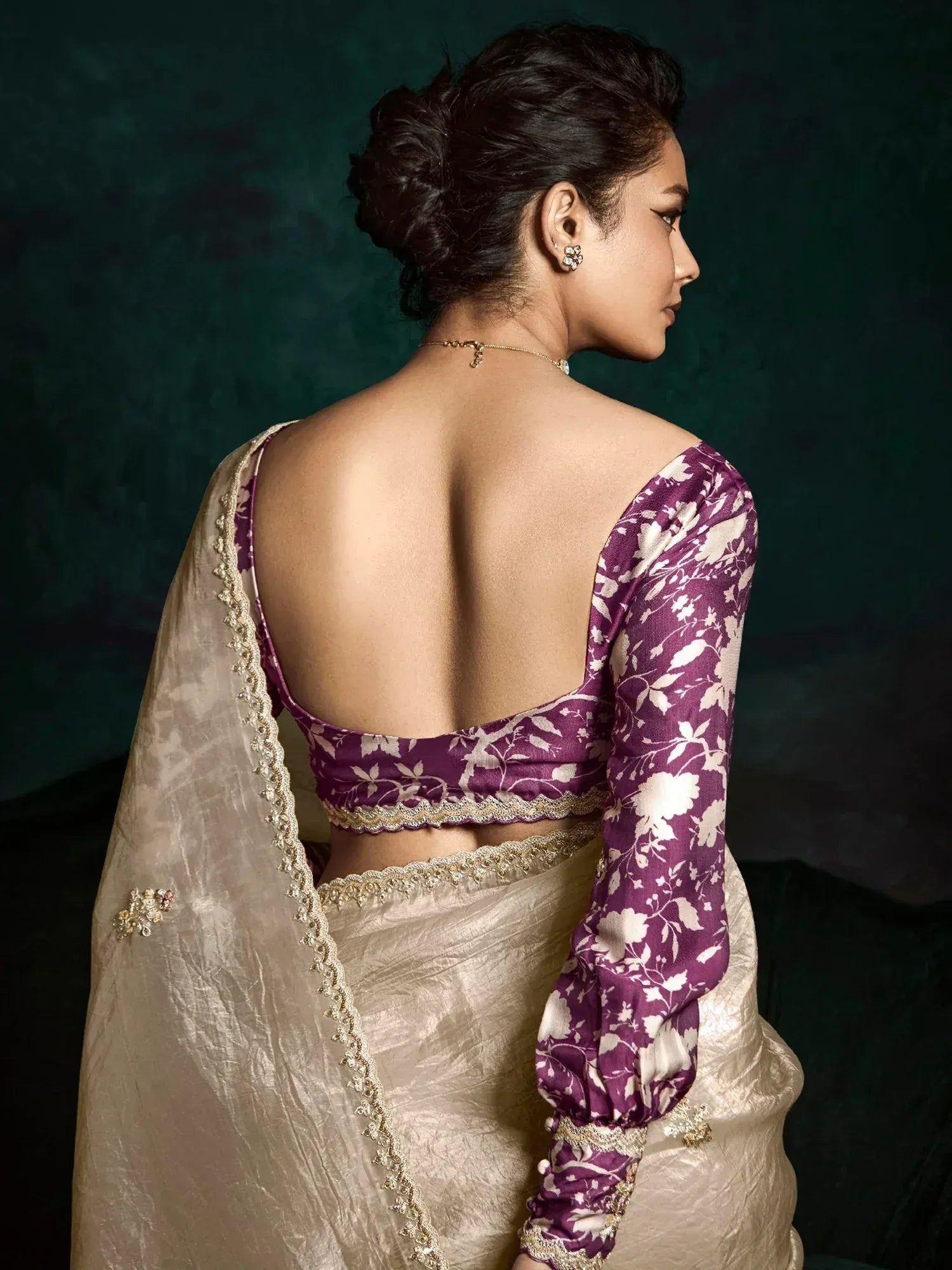 Purple floral blouse with backless design paired with cream saree, ethnic wear for women