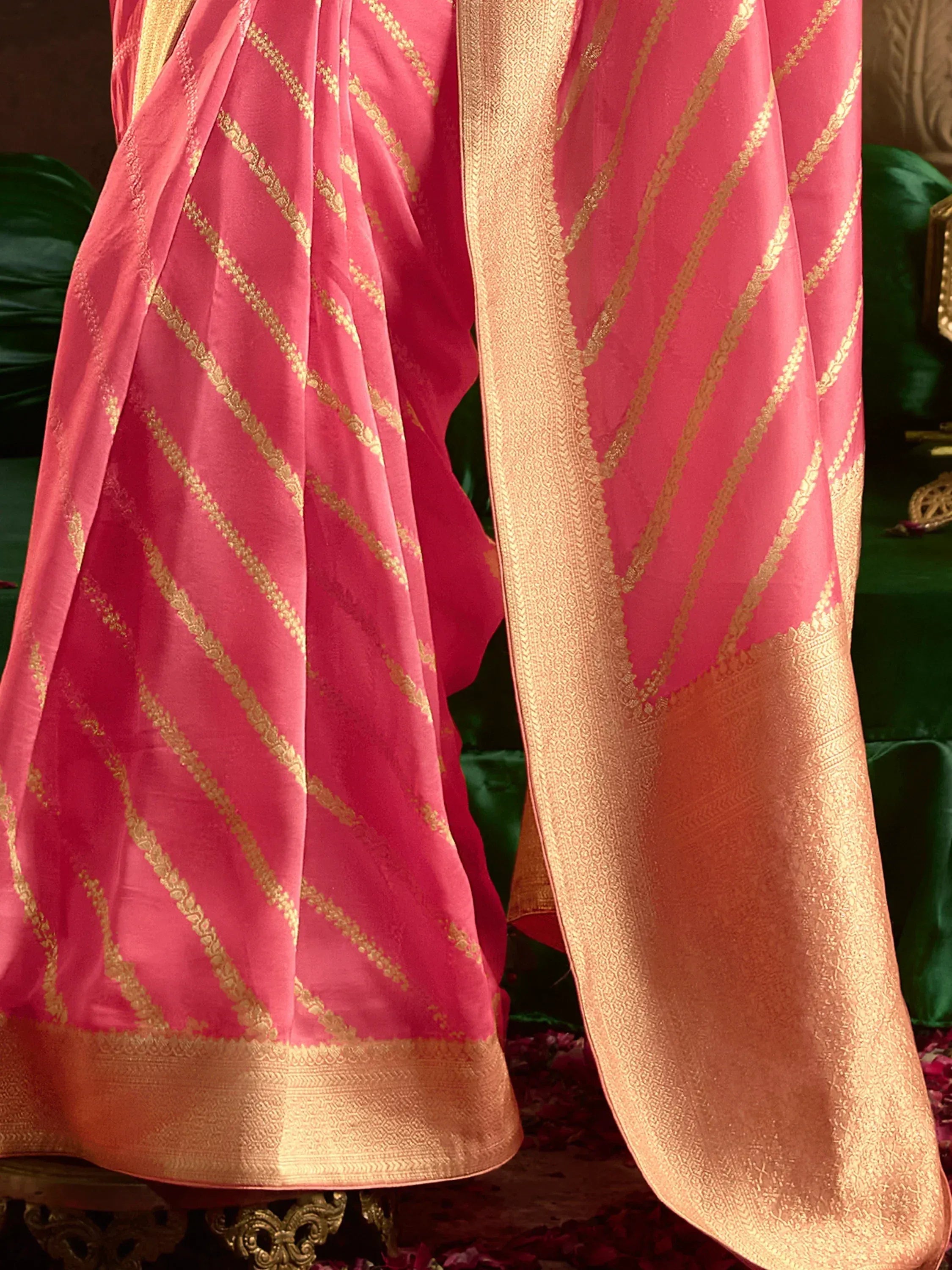Pink ethnic saree with gold zari stripes and border, traditional Indian designer wear