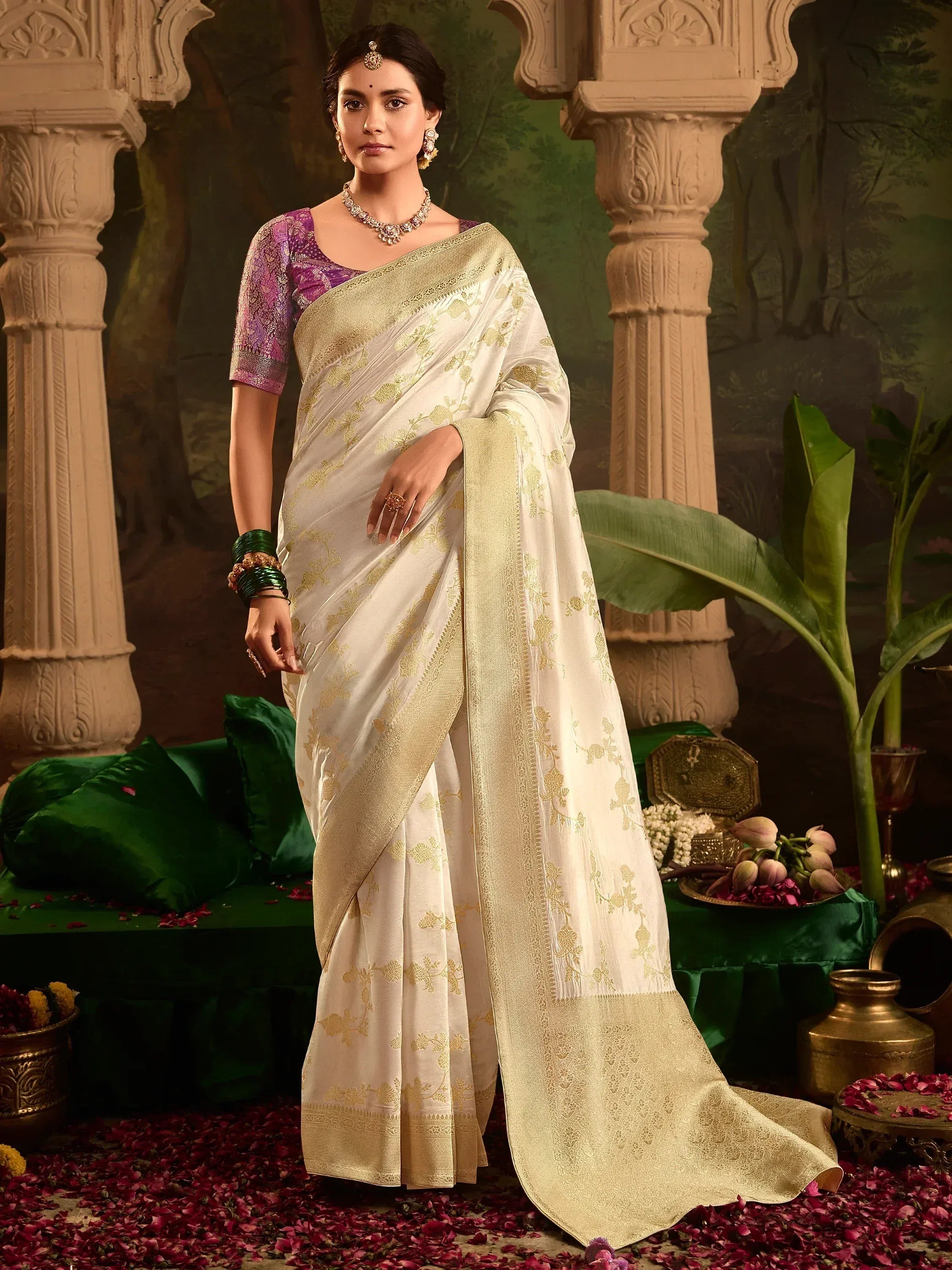 Elegant white saree with gold floral embroidery and purple blouse, perfect for Indian ethnic occasions