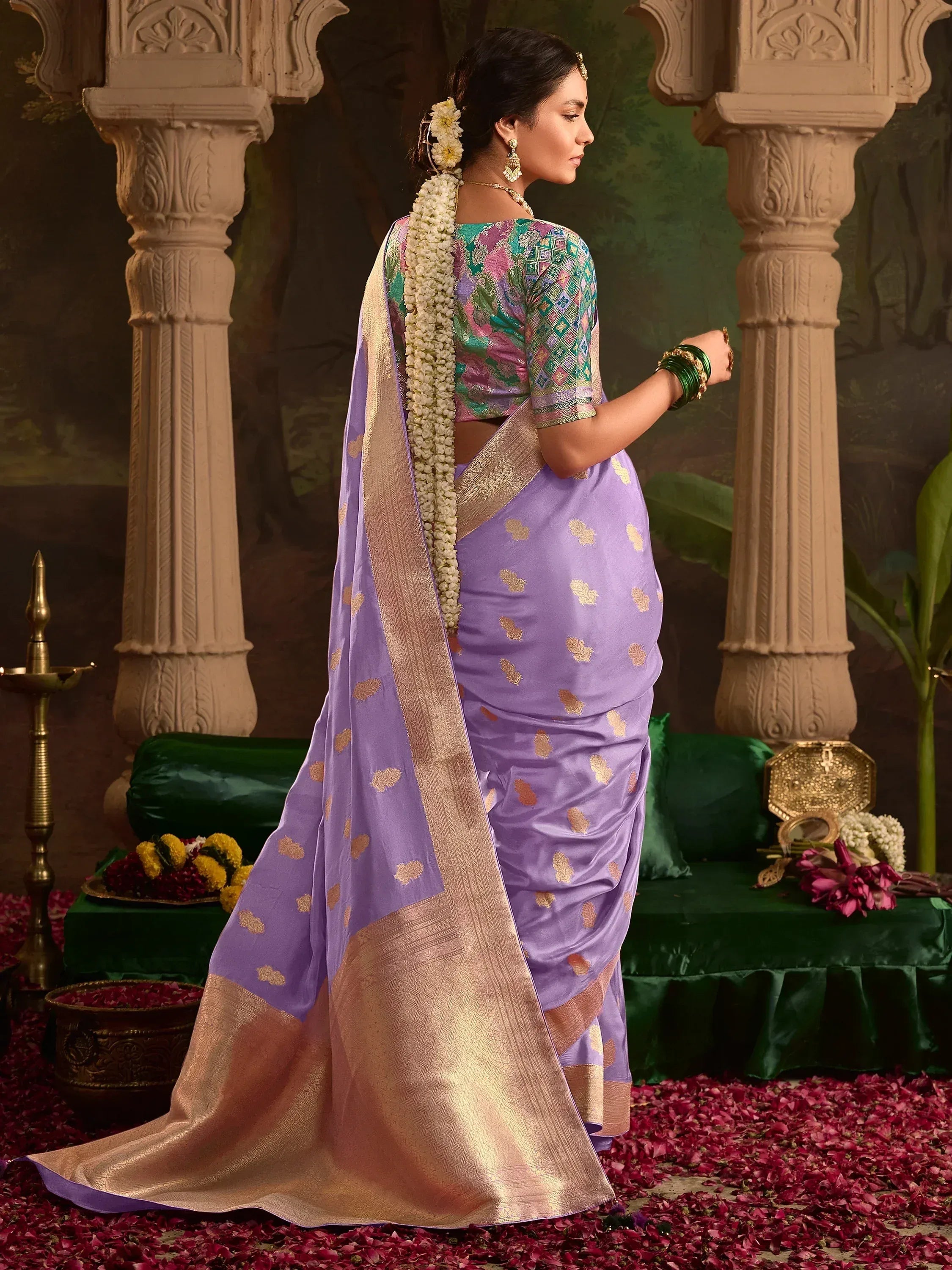 Purple silk saree with gold motifs and border, paired with colorful printed blouse, perfect for Indian ethnic occasions.