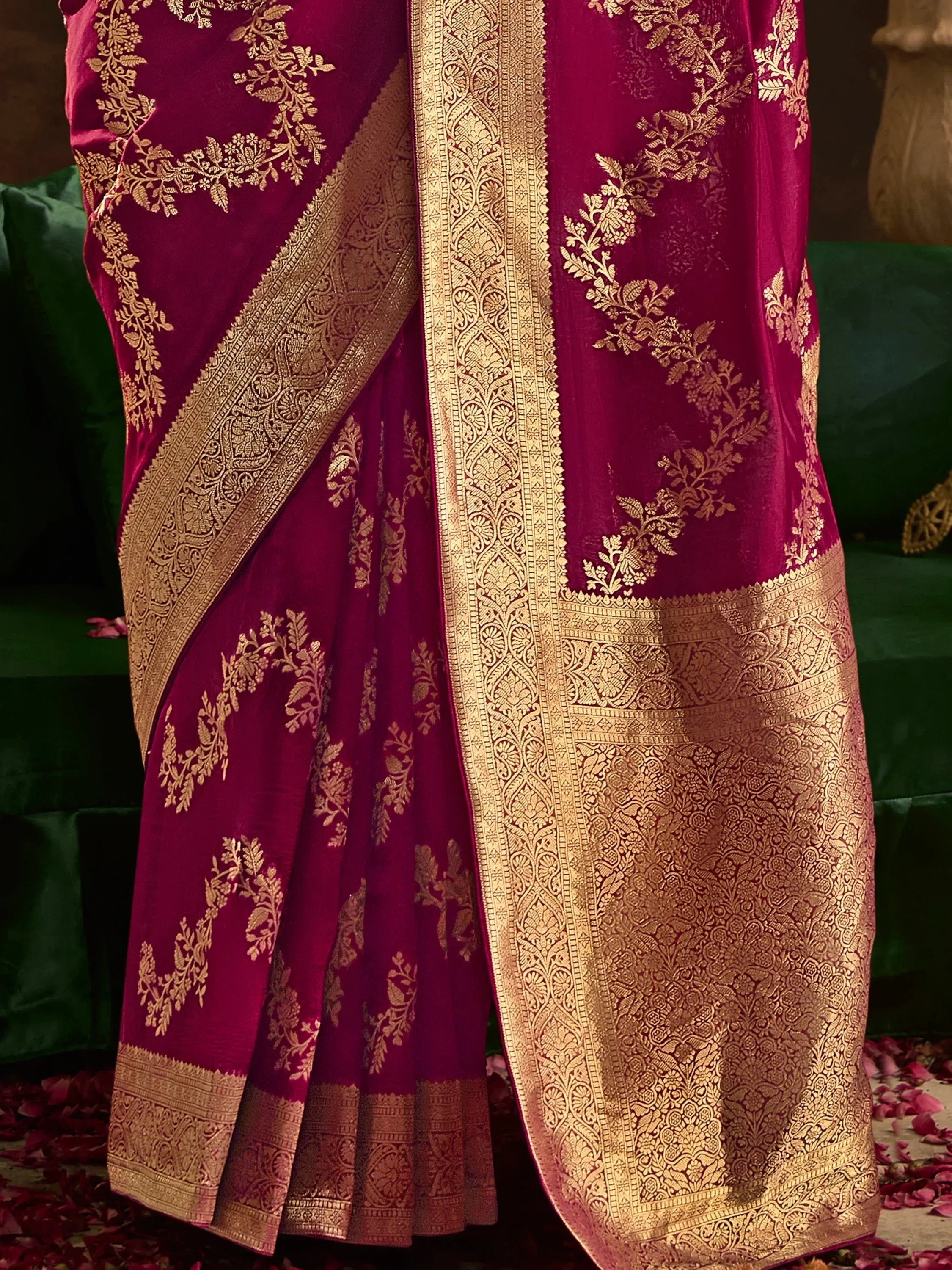 Luxury maroon saree with golden floral embroidery and intricate border design