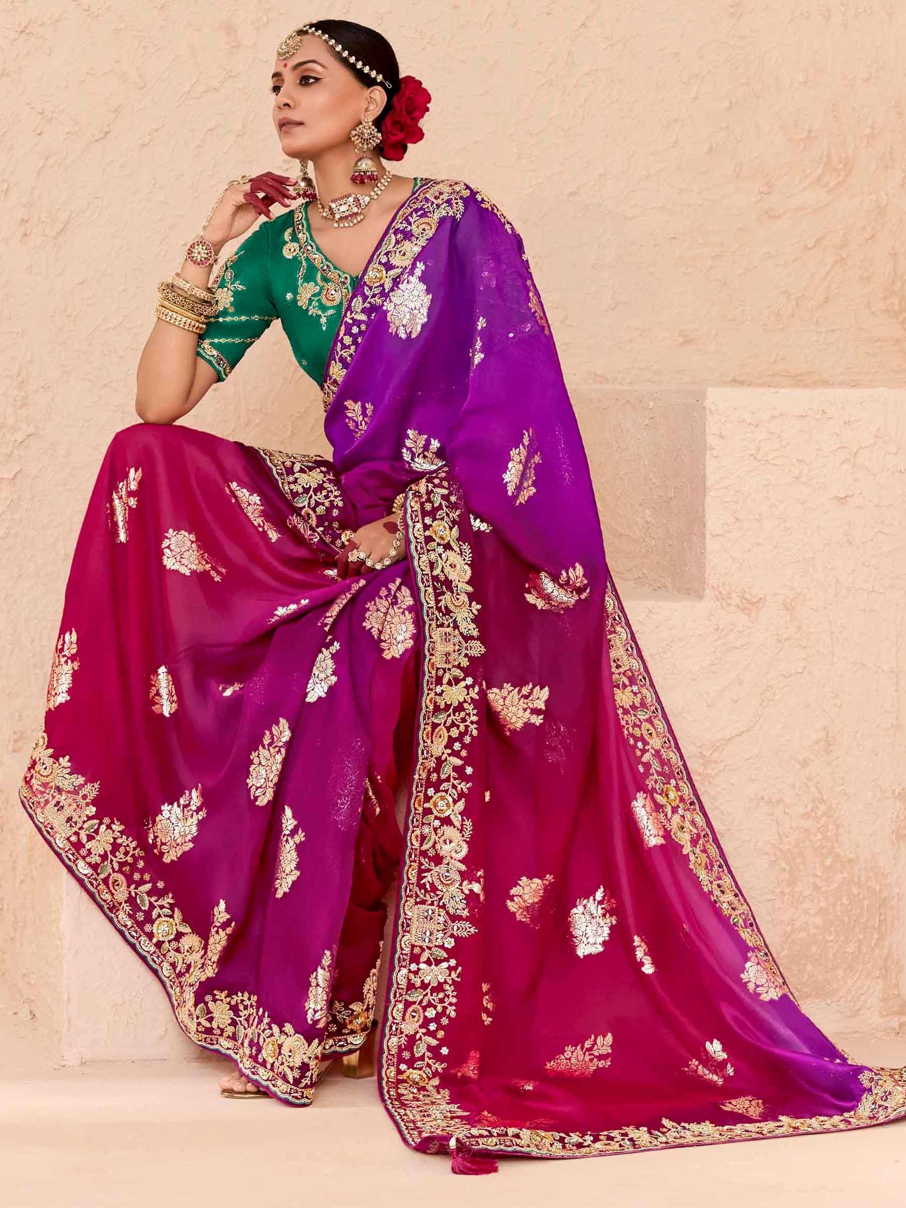 Elegant purple and green embroidered lehenga choli with gold floral detailing, perfect for Indian weddings and festive occasions.