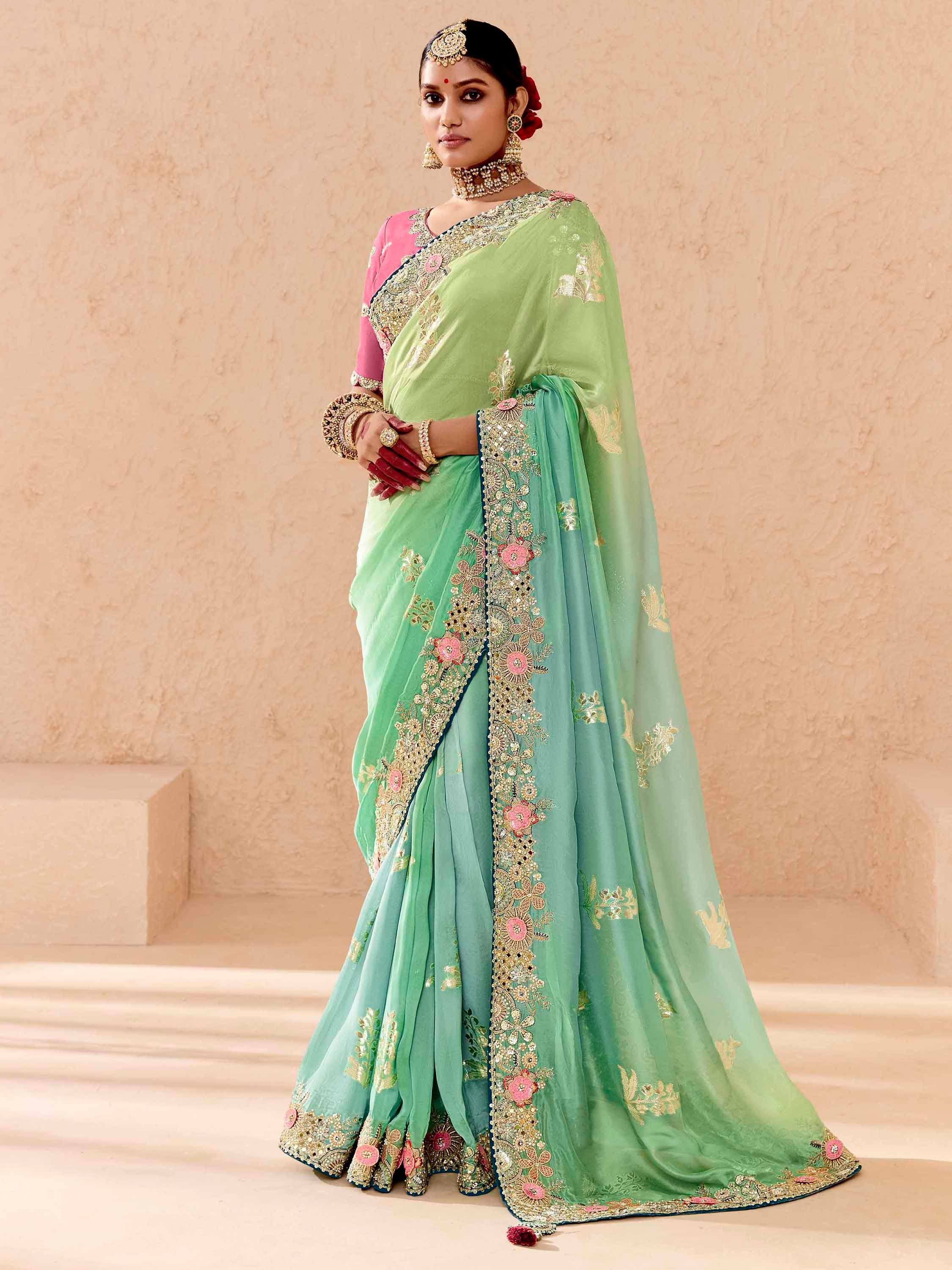 Green embroidered saree with pink blouse, perfect for Indian ethnic wear and festive occasions.