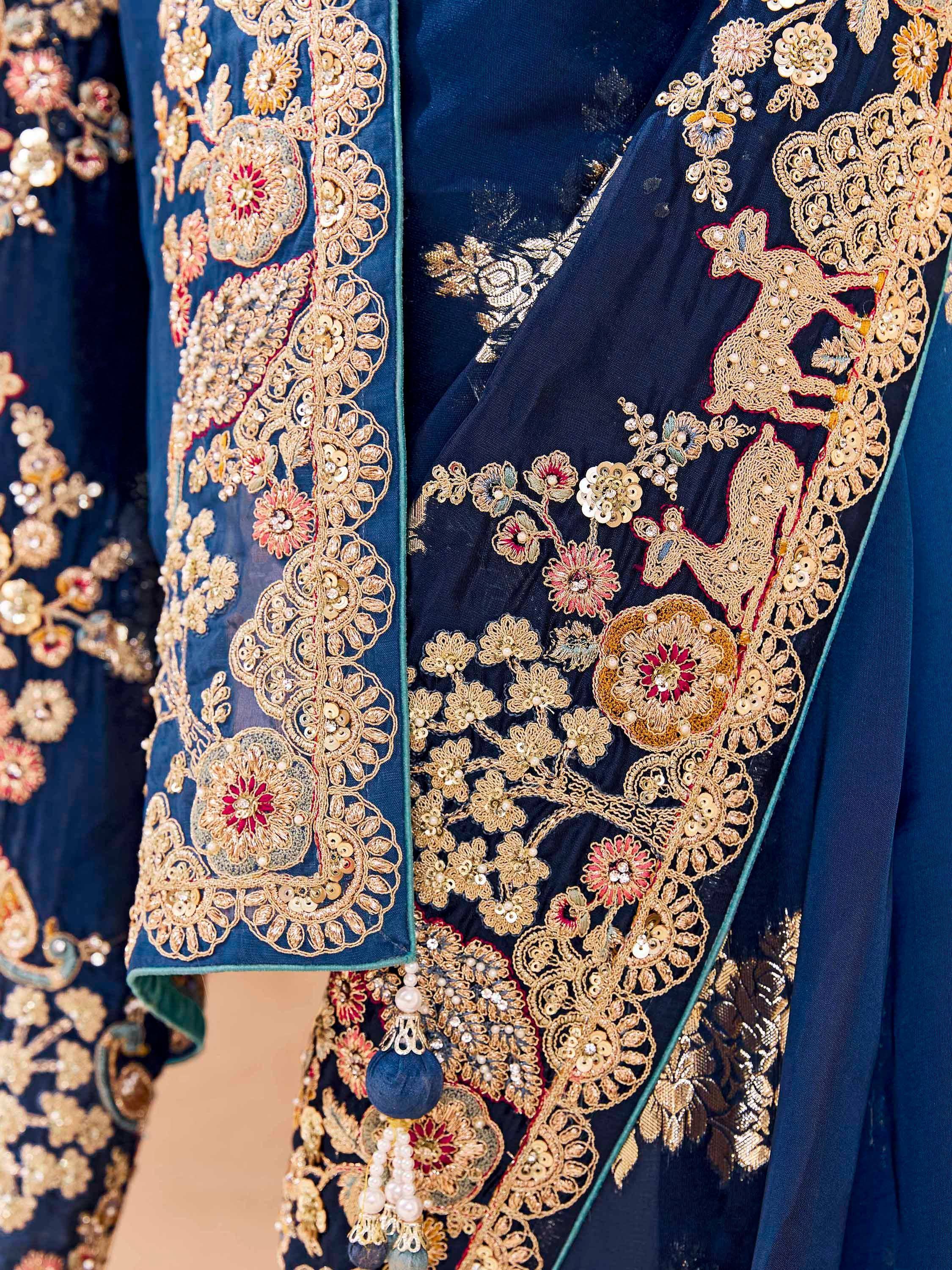 Navy blue ethnic gown with gold floral embroidery and sequin detailing for Indian weddings